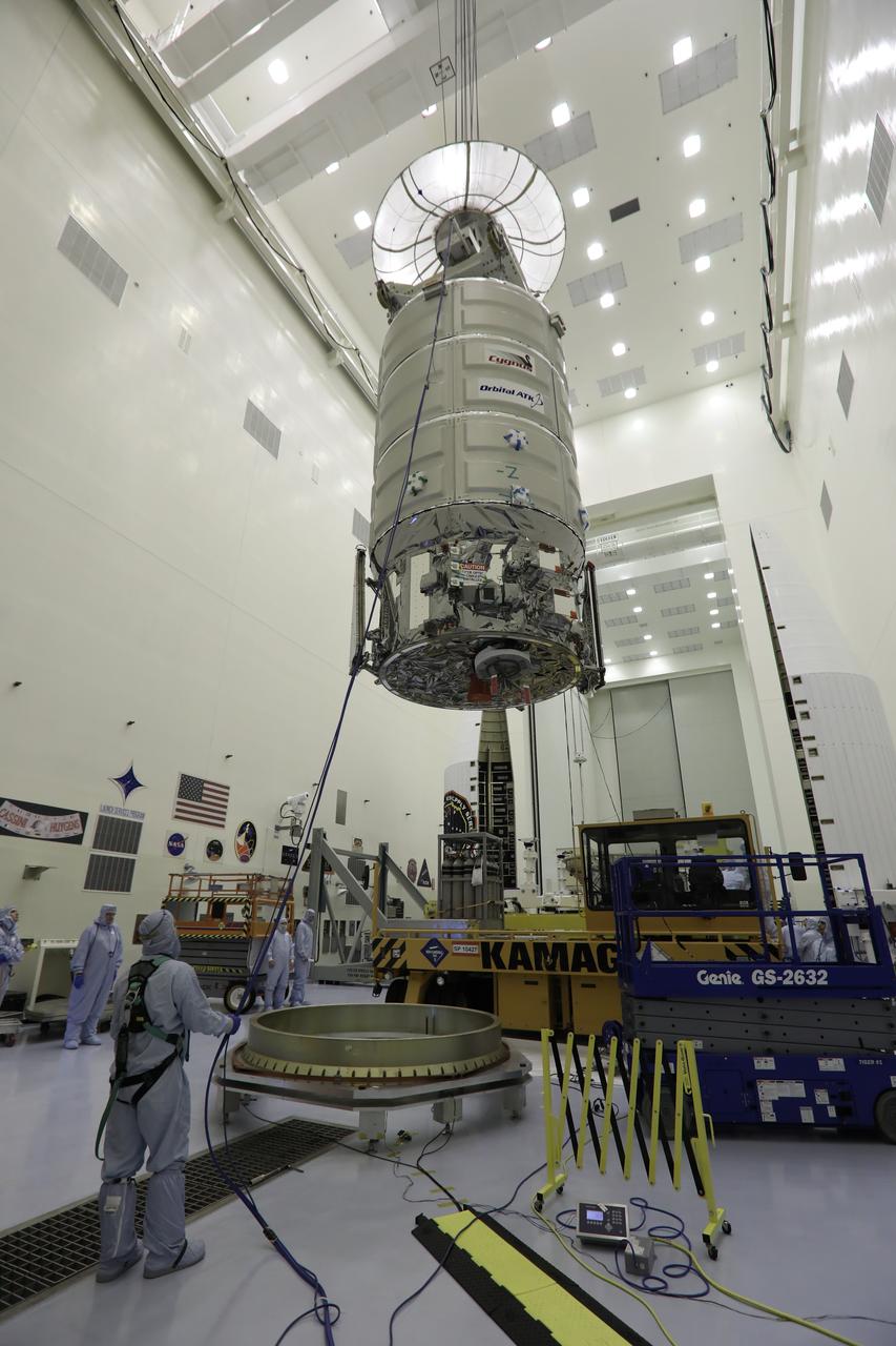 A crane lifts Orbital ATK's CYGNUS pressurized cargo module up and away from the KAMAG transporter inside the Payload Hazardous Servicing Facility at NASA's Kennedy Space Center in Florida. CYGNUS will be lowered onto a work stand for final propellant loading and late cargo stowage. The Orbital ATK CRS-7 commercial resupply services mission to the International Space Station is scheduled to launch atop a United Launch Alliance Atlas V rocket from Space Launch Complex 41 at Cape Canaveral Air Force Station on March 19, 2017. CYGNUS will deliver thousands of pounds of supplies, equipment and scientific research materials to the space station. 