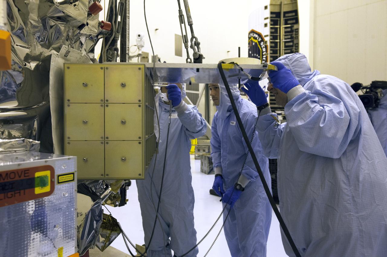 Inside the Payload Hazardous Servicing Facility at NASA's Kennedy Space Center in Florida, technicians begin the process to install several Nanoracks on the exterior of the Orbital ATK Cygnus pressurized cargo module. The Orbital ATK CRS-7 commercial resupply services mission to the International Space Station is scheduled to launch atop a United Launch Alliance Atlas V rocket from Space Launch Complex 41 at Cape Canaveral Air Force Station no earlier than March 21, 2017. Cygnus will deliver 7,600 pounds of supplies, equipment and scientific research materials to the space station.