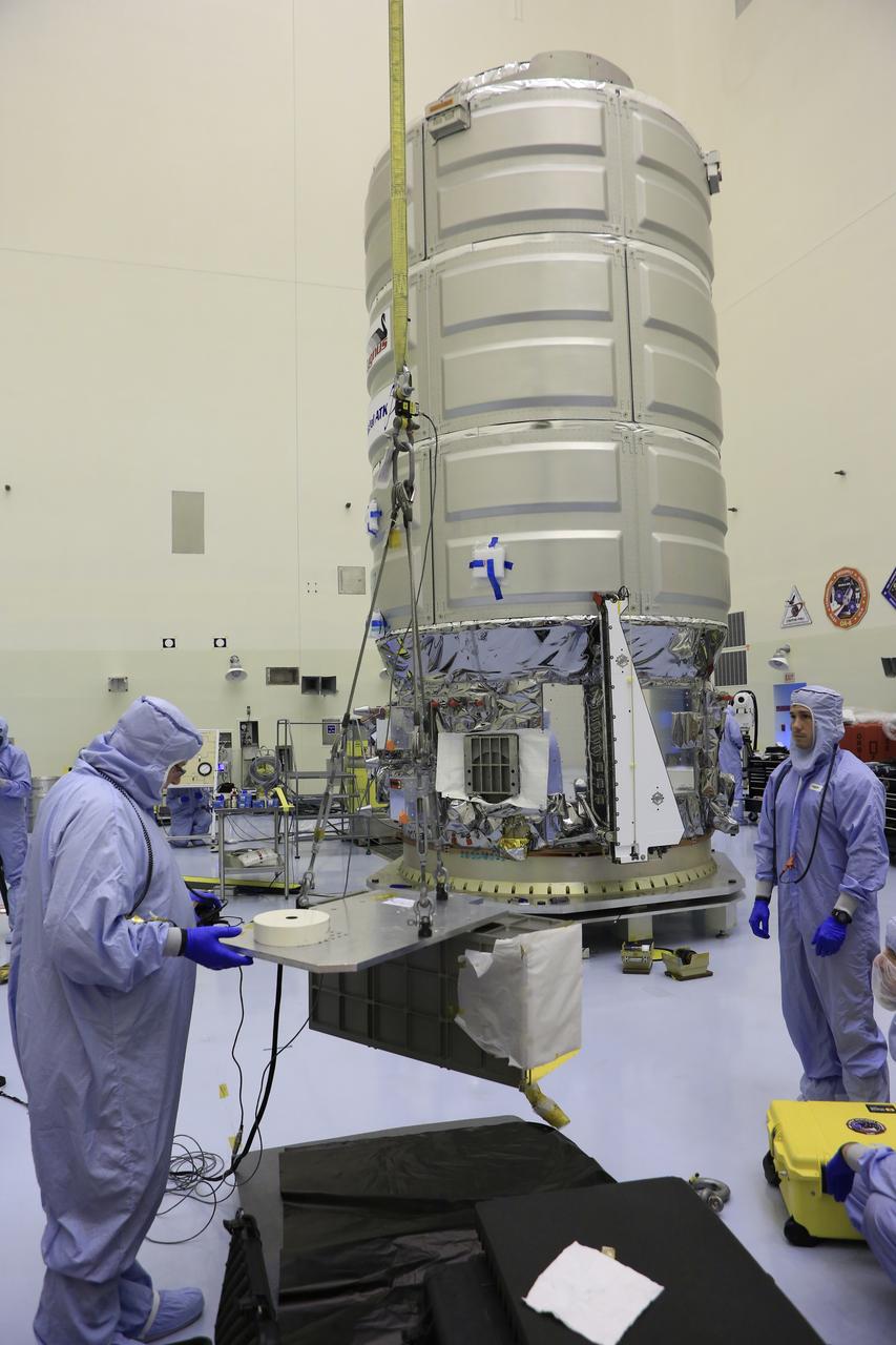 Inside the Payload Hazardous Servicing Facility at NASA's Kennedy Space Center in Florida, technicians prepare several Nanoracks for installation on the exterior of the Orbital ATK Cygnus pressurized cargo module. The Orbital ATK CRS-7 commercial resupply services mission to the International Space Station is scheduled to launch atop a United Launch Alliance Atlas V rocket from Space Launch Complex 41 at Cape Canaveral Air Force Station no earlier than March 21, 2017. Cygnus will deliver 7,600 pounds of supplies, equipment and scientific research materials to the space station.