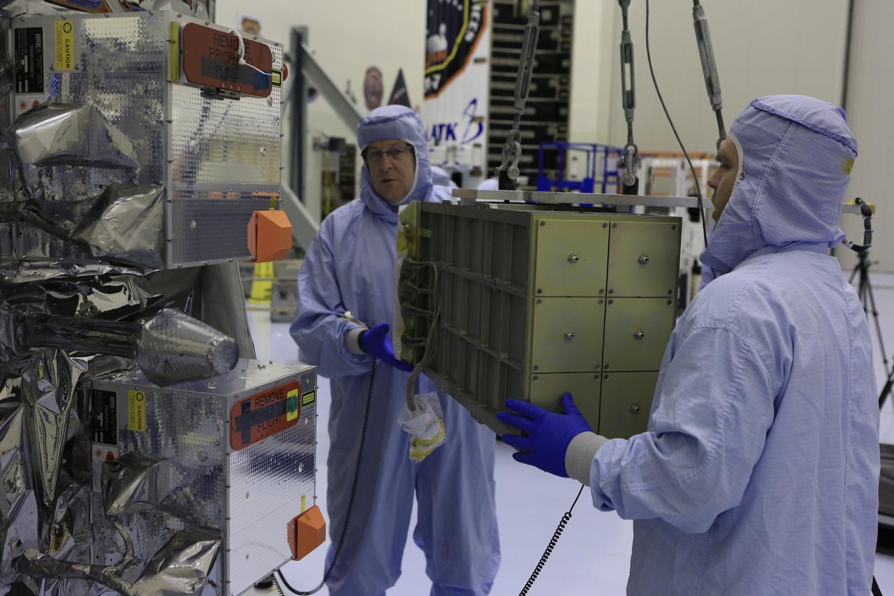 Inside the Payload Hazardous Servicing Facility at NASA's Kennedy Space Center in Florida, technicians prepare to install several Nanoracks on the exterior of the Orbital ATK Cygnus pressurized cargo module. The Orbital ATK CRS-7 commercial resupply services mission to the International Space Station is scheduled to launch atop a United Launch Alliance Atlas V rocket from Space Launch Complex 41 at Cape Canaveral Air Force Station no earlier than March 21, 2017. Cygnus will deliver 7,600 pounds of supplies, equipment and scientific research materials to the space station.