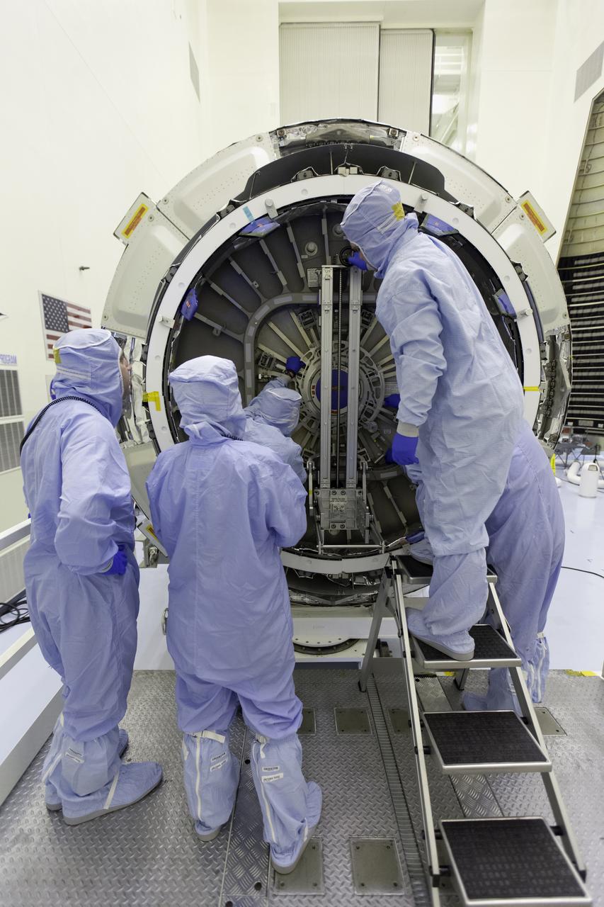 Inside the Payload Hazardous Servicing Facility at NASA's Kennedy Space Center in Florida, technicians are opening the hatch on the Orbital ATK Cygnus pressurized cargo module to prepare for late stowage of supplies and hardware. The Orbital ATK CRS-7 commercial resupply services mission to the International Space Station is scheduled to launch atop a United Launch Alliance Atlas V rocket from Space Launch Complex 41 at Cape Canaveral Air Force Station targeted for March 24, 2017. Cygnus will deliver 7,600 pounds of supplies, equipment and scientific research materials to the space station. 
