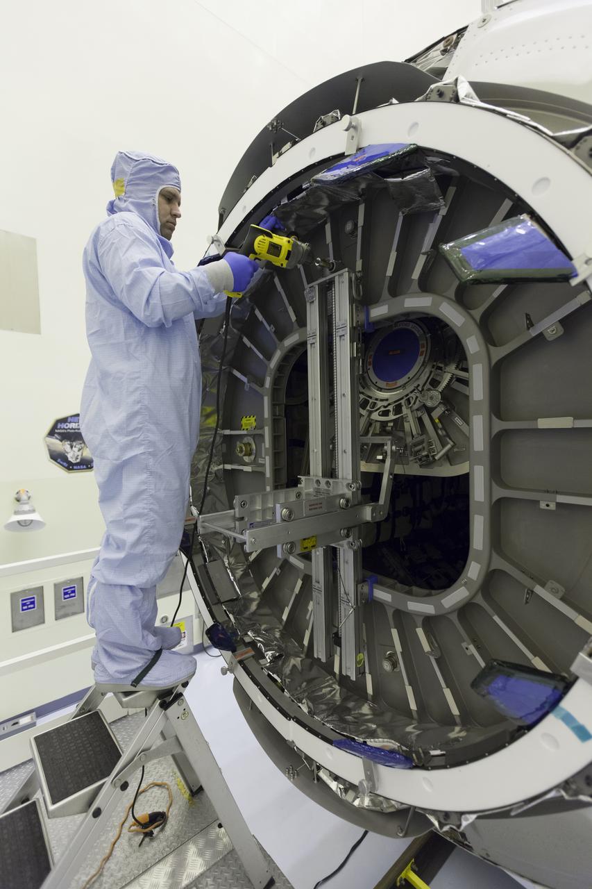 Inside the Payload Hazardous Servicing Facility at NASA's Kennedy Space Center in Florida, a technician open the hatch on the Orbital ATK Cygnus pressurized cargo module to prepare for late stowage of supplies and hardware. The Orbital ATK CRS-7 commercial resupply services mission to the International Space Station is scheduled to launch atop a United Launch Alliance Atlas V rocket from Space Launch Complex 41 at Cape Canaveral Air Force Station targeted for March 24, 2017. Cygnus will deliver 7,600 pounds of supplies, equipment and scientific research materials to the space station.