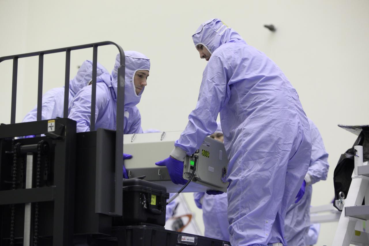 Inside the Payload Hazardous Servicing Facility at NASA's Kennedy Space Center in Florida, technicians prepare a powered cargo unit for late stowage in the Orbital ATK Cygnus pressurized cargo module. The Orbital ATK CRS-7 commercial resupply services mission to the International Space Station is scheduled to launch atop a United Launch Alliance Atlas V rocket from Space Launch Complex 41 at Cape Canaveral Air Force Station targeted for March 24, 2017. Cygnus will deliver 7,600 pounds of supplies, equipment and scientific research materials to the space station. 