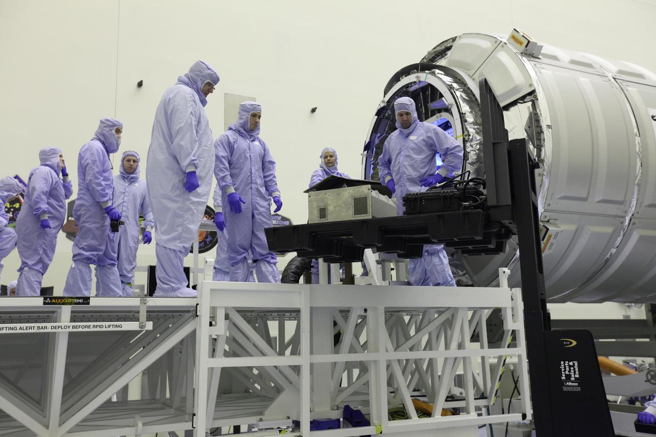 Inside the Payload Hazardous Servicing Facility at NASA's Kennedy Space Center in Florida, technicians prepare a powered cargo unit for late stowage in the Orbital ATK Cygnus pressurized cargo module. The Orbital ATK CRS-7 commercial resupply services mission to the International Space Station is scheduled to launch atop a United Launch Alliance Atlas V rocket from Space Launch Complex 41 at Cape Canaveral Air Force Station targeted for March 24, 2017. Cygnus will deliver 7,600 pounds of supplies, equipment and scientific research materials to the space station.
