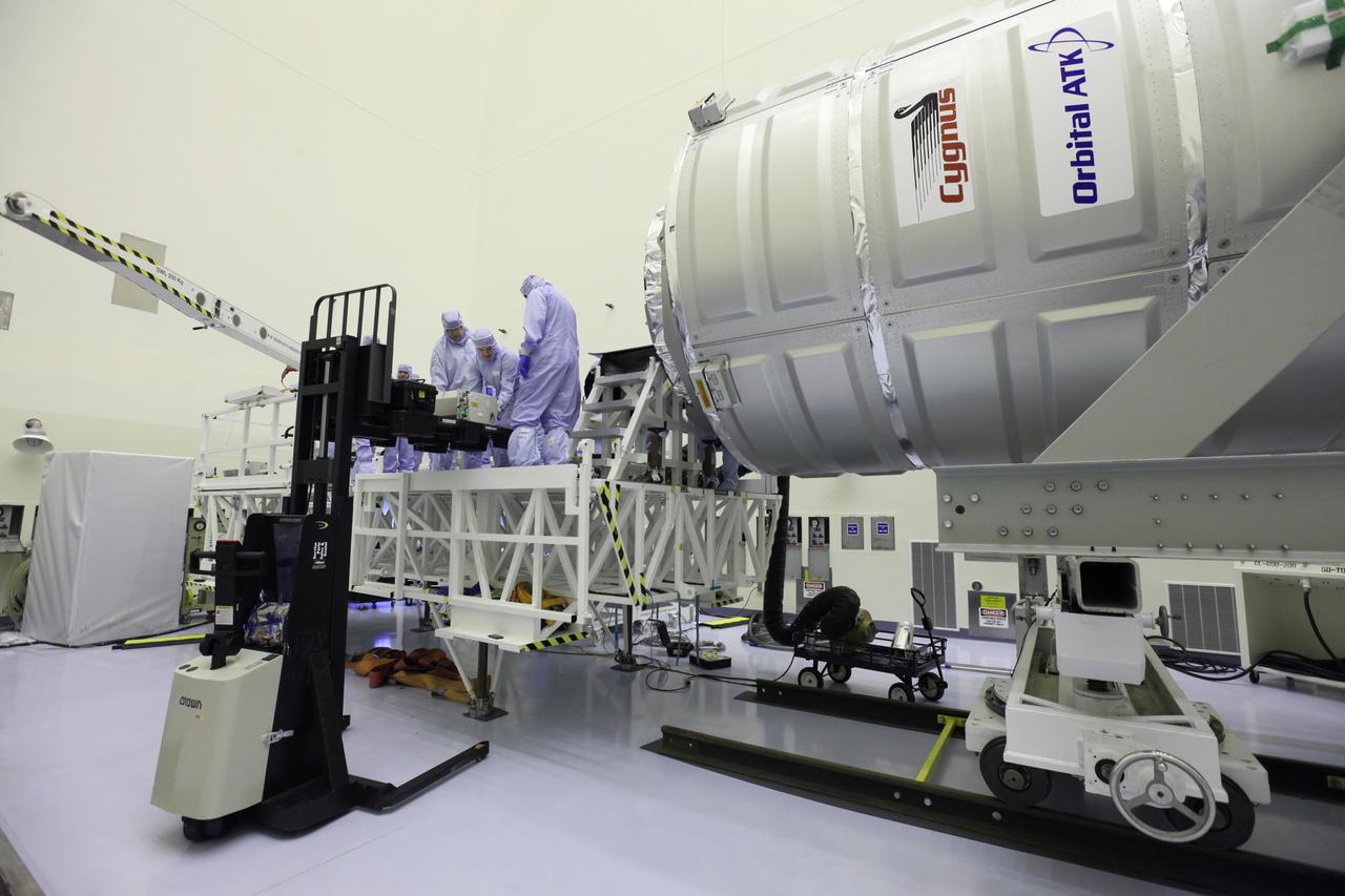 Inside the Payload Hazardous Servicing Facility at NASA's Kennedy Space Center in Florida, technicians prepare a powered cargo unit for late stowage in the Orbital ATK Cygnus pressurized cargo module. The Orbital ATK CRS-7 commercial resupply services mission to the International Space Station is scheduled to launch atop a United Launch Alliance Atlas V rocket from Space Launch Complex 41 at Cape Canaveral Air Force Station targeted for March 24, 2017. Cygnus will deliver 7,600 pounds of supplies, equipment and scientific research materials to the space station. 