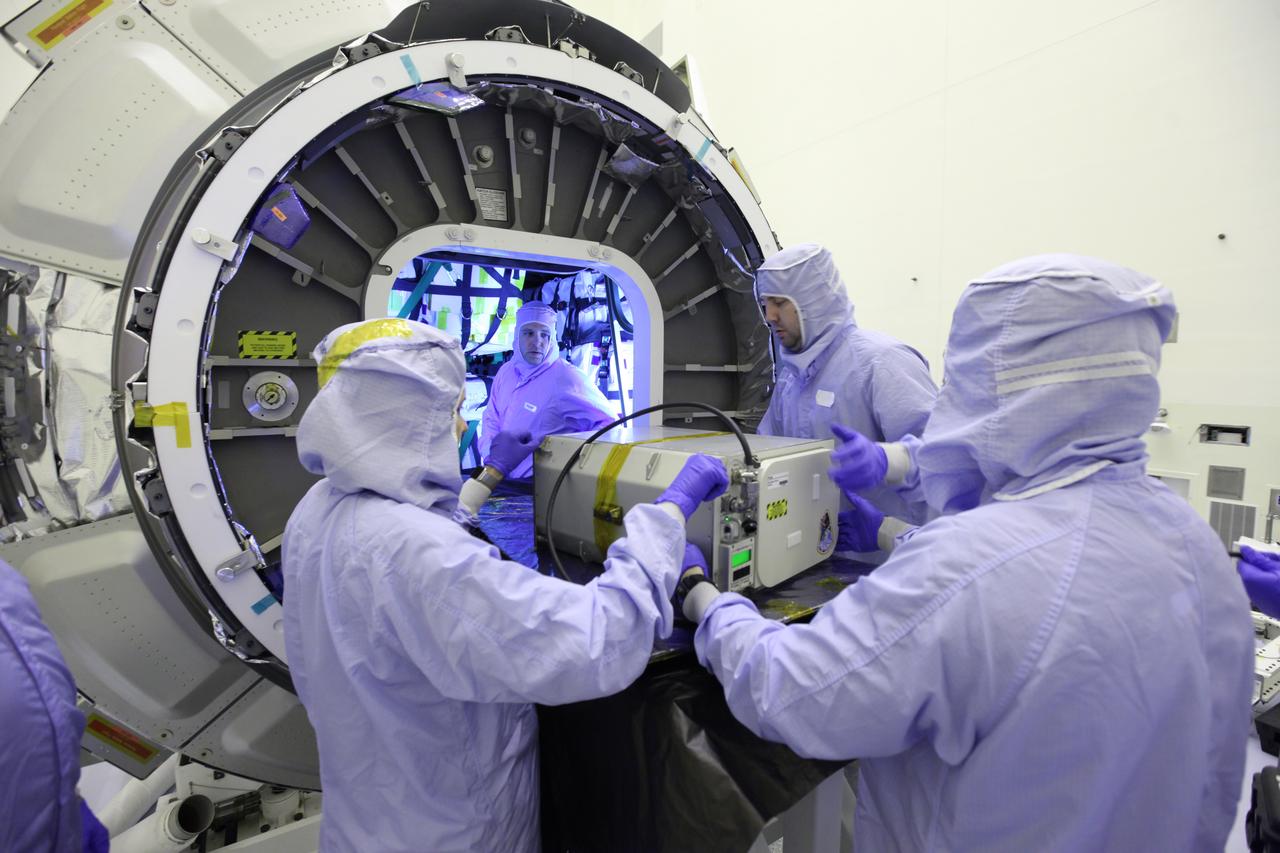 Inside the Payload Hazardous Servicing Facility at NASA's Kennedy Space Center in Florida, technicians perform final cargo installation in the Orbital ATK Cygnus pressurized cargo module. The Orbital ATK CRS-7 commercial resupply services mission to the International Space Station is scheduled to launch atop a United Launch Alliance Atlas V rocket from Space Launch Complex 41 at Cape Canaveral Air Force Station no earlier than March 21, 2017. Cygnus will deliver 7,600 pounds of supplies, equipment and scientific research materials to the space station.