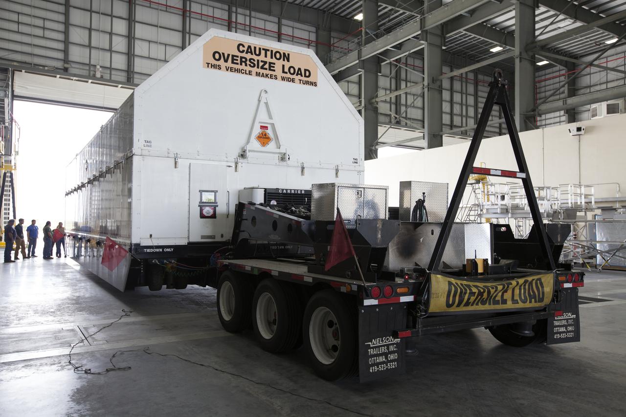 The first integrated piece of flight hardware for NASA's Space Launch System (SLS) rocket, the Interim Cryogenic Propulsion Stage (ICPS) was offloaded from the Mariner barge at Cape Canaveral Air Force Station in Florida, and transported to the United Launch Alliance (ULA) Horizontal Integration Facility where it will be removed from its flight case. The ICPS was shipped from the United Launch Alliance (ULA) facility in Decatur, Alabama. The ICPS is the in-space stage that is located toward the top of the rocket, between the Launch Vehicle Stage Adapter and the Orion Spacecraft Adapter. It will provide some of the in-space propulsion during Orion's first flight test atop the SLS on Exploration Mission 1. 