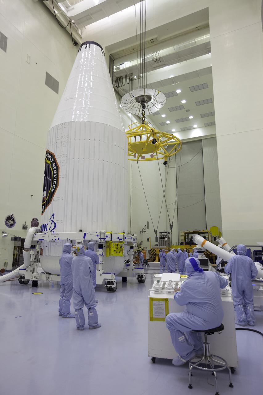 Inside the Payload Hazardous Servicing Facility at NASA's Kennedy Space Center in Florida, preparations are underway to move the Orbital ATK Cygnus pressurized cargo module, enclosed in its payload fairing, to a KAMAG transporter. The Orbital ATK CRS-7 commercial resupply services mission to the International Space Station is scheduled to launch atop a United Launch Alliance Atlas V rocket from Space Launch Complex 41 at Cape Canaveral Air Force Station. Cygnus will deliver 7,600 pounds of supplies, equipment and scientific research materials to the space station.