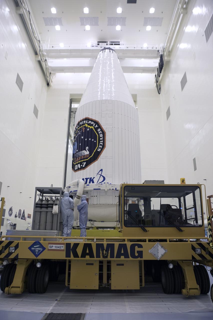 Inside the Payload Hazardous Servicing Facility at NASA's Kennedy Space Center in Florida, the Orbital ATK Cygnus pressurized cargo module, enclosed in its payload fairing, is secured on a KAMAG transporter. The Orbital ATK CRS-7 commercial resupply services mission to the International Space Station is scheduled to launch atop a United Launch Alliance Atlas V rocket from Space Launch Complex 41 at Cape Canaveral Air Force Station. Cygnus will deliver 7,600 pounds of supplies, equipment and scientific research materials to the space station.