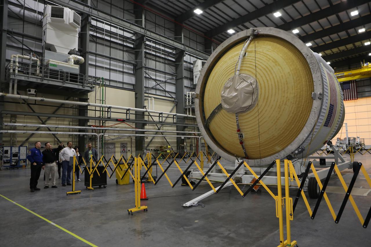 Inside the United Launch Alliance Horizontal Integration Facility at Cape Canaveral Air Force Station in Florida, NASA astronaut Barry "Butch" Wilmore, far left, views the first integrated piece of flight hardware for NASA's Space Launch System (SLS) rocket, the Interim Cryogenic Propulsion Stage (ICPS). The ICPS is the in-space stage that is located toward the top of the rocket, between the Launch Vehicle Stage Adapter and the Orion Spacecraft Adapter. It will provide some of the in-space propulsion during Orion's first flight test atop the SLS on Exploration Mission 1.