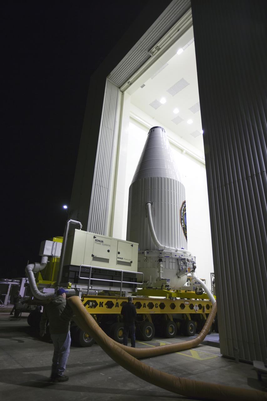 The Orbital ATK Cygnus pressurized cargo module, enclosed in its payload fairing and secured on a KAMAG transporter, departs the Payload Hazardous Servicing Facility at NASA's Kennedy Space Center in Florida. Cygnus will be transported to Space Launch Complex 41 at Cape Canaveral Air Force Station for mating to the United Launch Alliance (ULA) Atlas V rocket. The Orbital ATK CRS-7 commercial resupply services mission to the International Space Station is scheduled to launch atop the Atlas V from pad 41. Cygnus will deliver 7,600 pounds of supplies, equipment and scientific research materials to the space station. 
