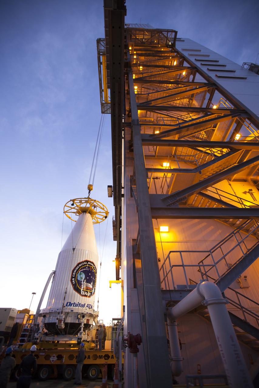 The payload fairing containing the Orbital ATK Cygnus pressurized cargo module is lifted by crane at the United Launch Alliance (ULA) Vertical Integration Facility at Space Launch Complex 41 at Cape Canaveral Air Force Station in Florida. The payload will be hoisted up and mated to the ULA Atlas V rocket. The Orbital ATK CRS-7 commercial resupply services mission to the International Space Station is scheduled to launch atop the Atlas V from pad 41. Cygnus will deliver 7,600 pounds of supplies, equipment and scientific research materials to the space station.
