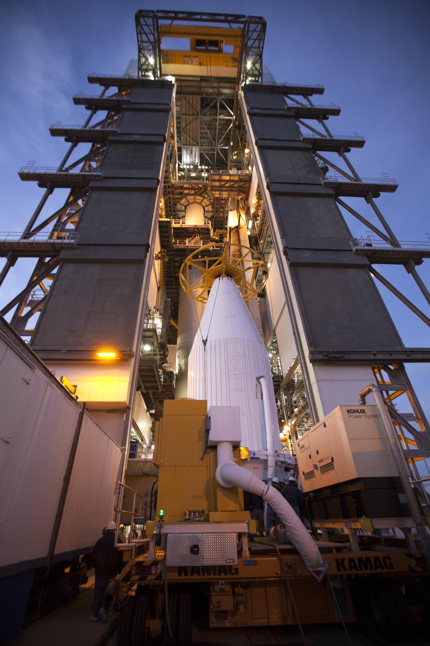 The payload fairing containing the Orbital ATK Cygnus pressurized cargo module is lifted by crane at the United Launch Alliance (ULA) Vertical Integration Facility at Space Launch Complex 41 at Cape Canaveral Air Force Station in Florida. The payload will be hoisted up and mated to the ULA Atlas V rocket. The Orbital ATK CRS-7 commercial resupply services mission to the International Space Station is scheduled to launch atop the Atlas V from pad 41. Cygnus will deliver 7,600 pounds of supplies, equipment and scientific research materials to the space station.