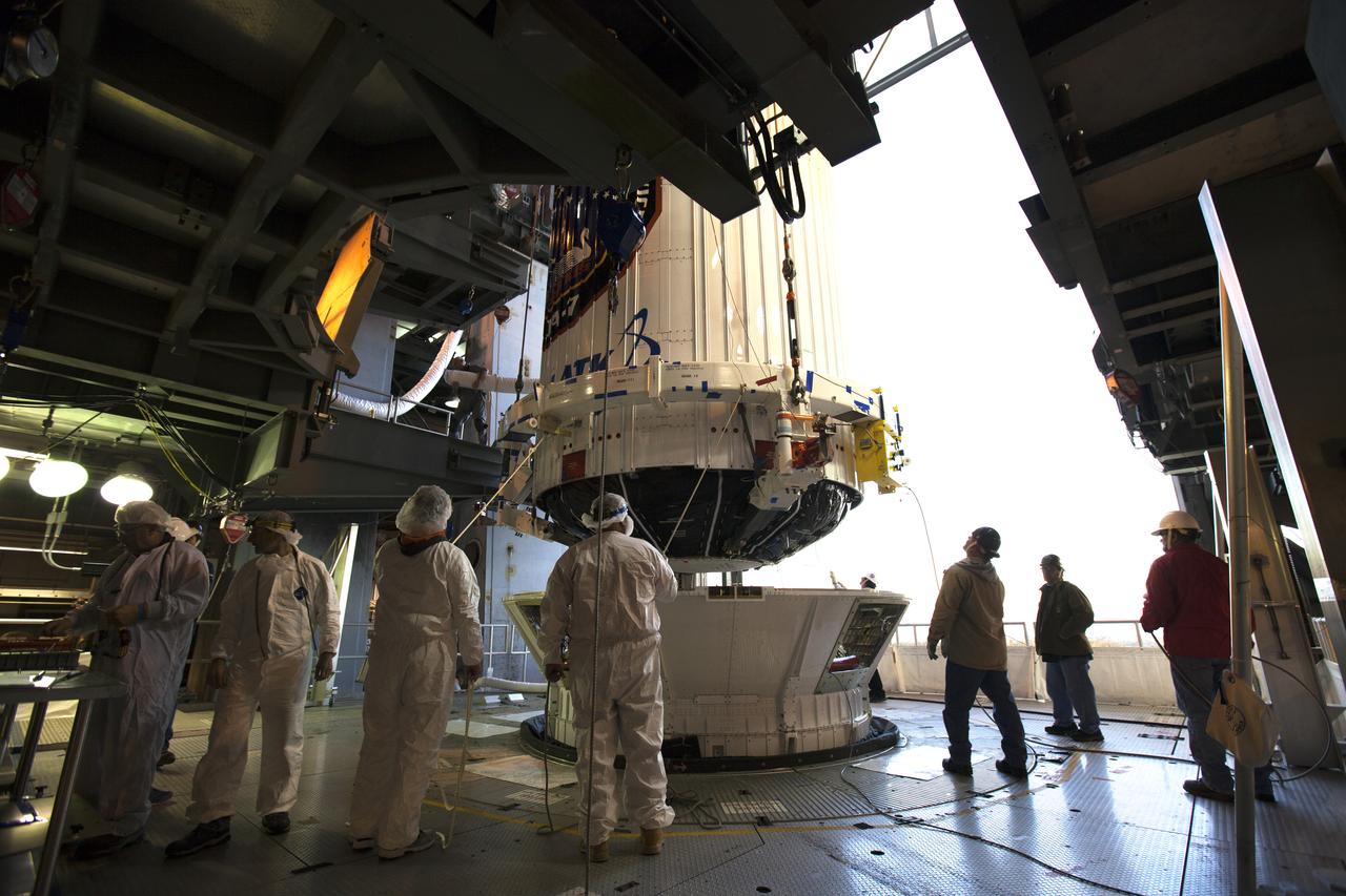 The payload fairing containing the Orbital ATK Cygnus pressurized cargo module is lowered onto the Centaur upper stage, or second stage, of the United Launch Alliance (ULA) rocket in the Vertical Integration Facility at Space Launch Complex 41 at Cape Canaveral Air Force Station in Florida. The Orbital ATK CRS-7 commercial resupply services mission to the International Space Station is scheduled to launch atop the Atlas V from pad 41. Cygnus will deliver 7,600 pounds of supplies, equipment and scientific research materials to the space station.