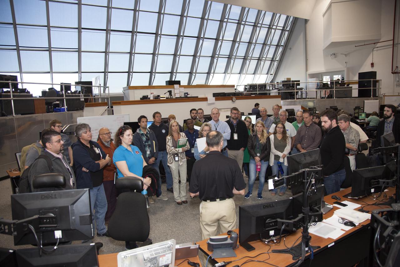 NASA engineers and test directors gather in Firing Room 3 in the Launch Control Center at NASA's Kennedy Space Center in Florida, to watch a demonstration of the automated command and control software for the agency's Space Launch System (SLS) and Orion spacecraft. The software is called the Ground Launch Sequencer. It will be responsible for nearly all of the launch commit criteria during the final phases of launch countdowns. The Ground and Flight Application Software Team (GFAST) demonstrated the software. It was developed by the Command, Control and Communications team in the Ground Systems Development and Operations (GSDO) Program. GSDO is helping to prepare the center for the first test flight of Orion atop the SLS on Exploration Mission 1. 