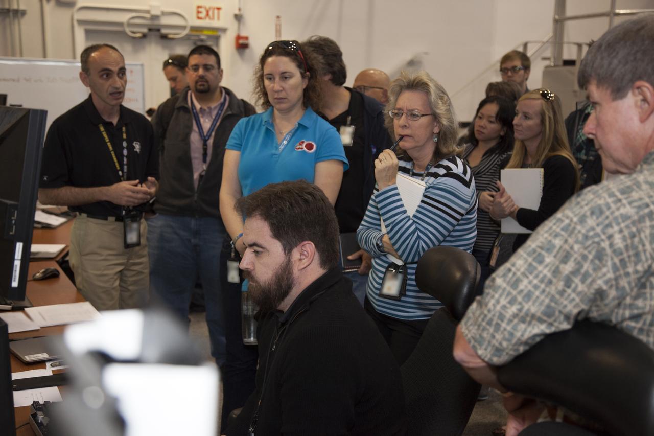 NASA engineers and test directors gather in Firing Room 3 in the Launch Control Center at NASA's Kennedy Space Center in Florida, to watch a demonstration of the automated command and control software for the agency's Space Launch System (SLS) and Orion spacecraft. The software is called the Ground Launch Sequencer. It will be responsible for nearly all of the launch commit criteria during the final phases of launch countdowns. The Ground and Flight Application Software Team (GFAST) demonstrated the software. It was developed by the Command, Control and Communications team in the Ground Systems Development and Operations (GSDO) Program. GSDO is helping to prepare the center for the first test flight of Orion atop the SLS on Exploration Mission 1. 