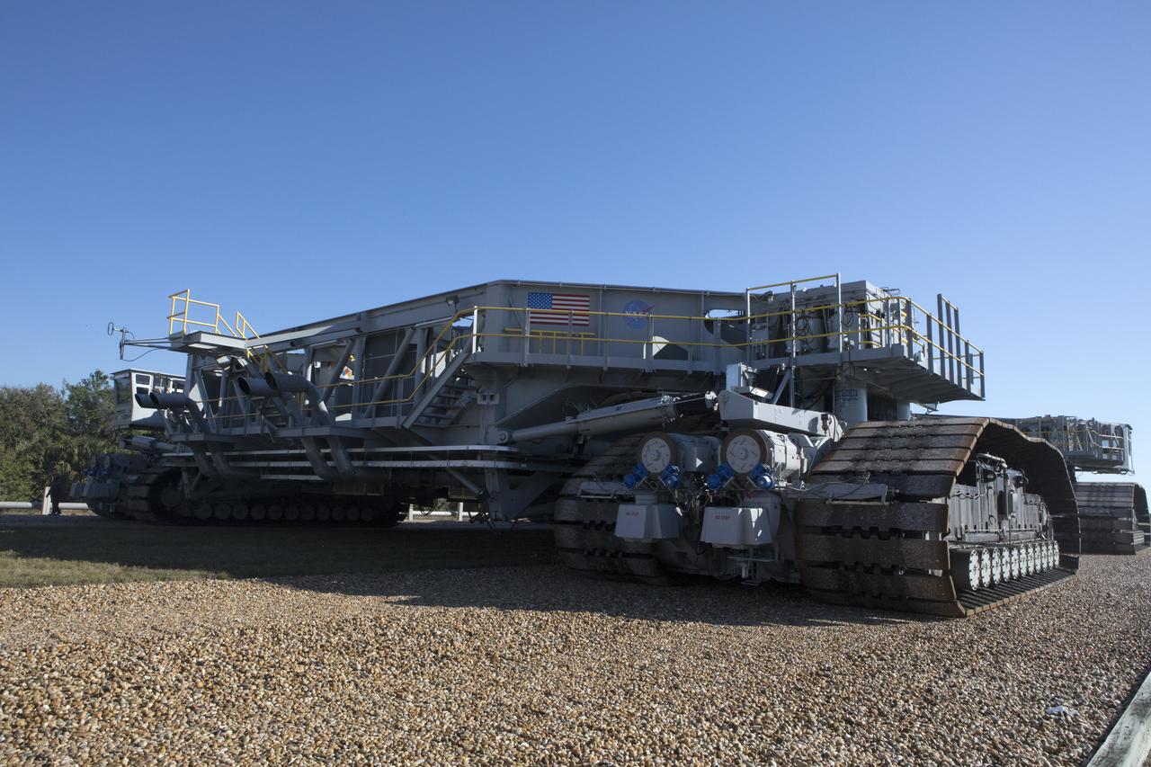 Crawler-transporter 2 (CT-2) moves slowly along the crawlerway on its way back to the Vehicle Assembly Building at NASA's Kennedy Space Center in Florida. The crawler took a trip to the Pad A/B split to test upgrades recently completed that will allow the giant vehicle to handle the load of the agency's Space Launch System rocket and Orion spacecraft atop the mobile launcher. The Ground Systems Development and Operations Program oversaw upgrades to the 50-year-old CT-2. New generators, gear assemblies, jacking, equalizing and leveling (JEL) hydraulic cylinders, roller bearings and brakes were installed, and other components were upgraded to prepare for Exploration Mission 1.  