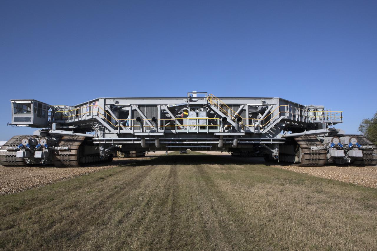 A full view of crawler-transporter 2 (CT-2) as it moves slowly along the crawlerway on its way back to the Vehicle Assembly Building at NASA's Kennedy Space Center in Florida. The crawler took a trip to the Pad A/B split to test upgrades recently completed that will allow the giant vehicle to handle the load of the agency's Space Launch System rocket and Orion spacecraft atop the mobile launcher. The Ground Systems Development and Operations Program oversaw upgrades to the 50-year-old CT-2. New generators, gear assemblies, jacking, equalizing and leveling (JEL) hydraulic cylinders, roller bearings and brakes were installed, and other components were upgraded to prepare for Exploration Mission 1. 