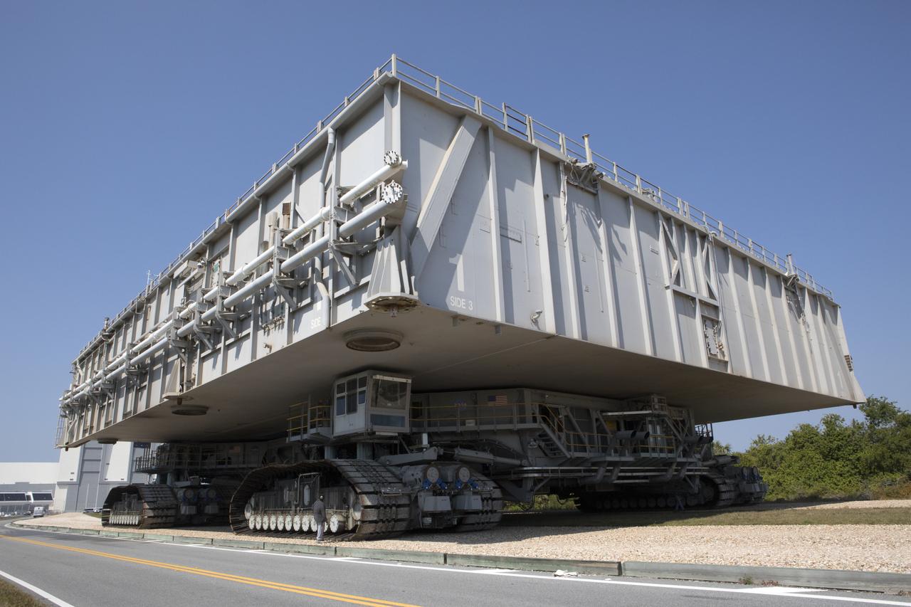 NASA's upgraded crawler-transporter 2 (CT-2), carrying mobile launcher platform 1, moves slowly along the crawlerway toward the Vehicle Assembly Building at the agency's Kennedy Space Center in Florida. The crawler's upgrades and modifications were monitored and tested during a loaded test to the crawlerway Pad A/B split. CT-2 will return to the crawler yard. The crawler is being tested to confirm it is ready to support the load of the mobile launcher carrying the Space Launch System with Orion atop for the first test flight, Exploration Mission 1. The Ground Systems Development and Operations Program at Kennedy is managing upgrades to the crawler. 