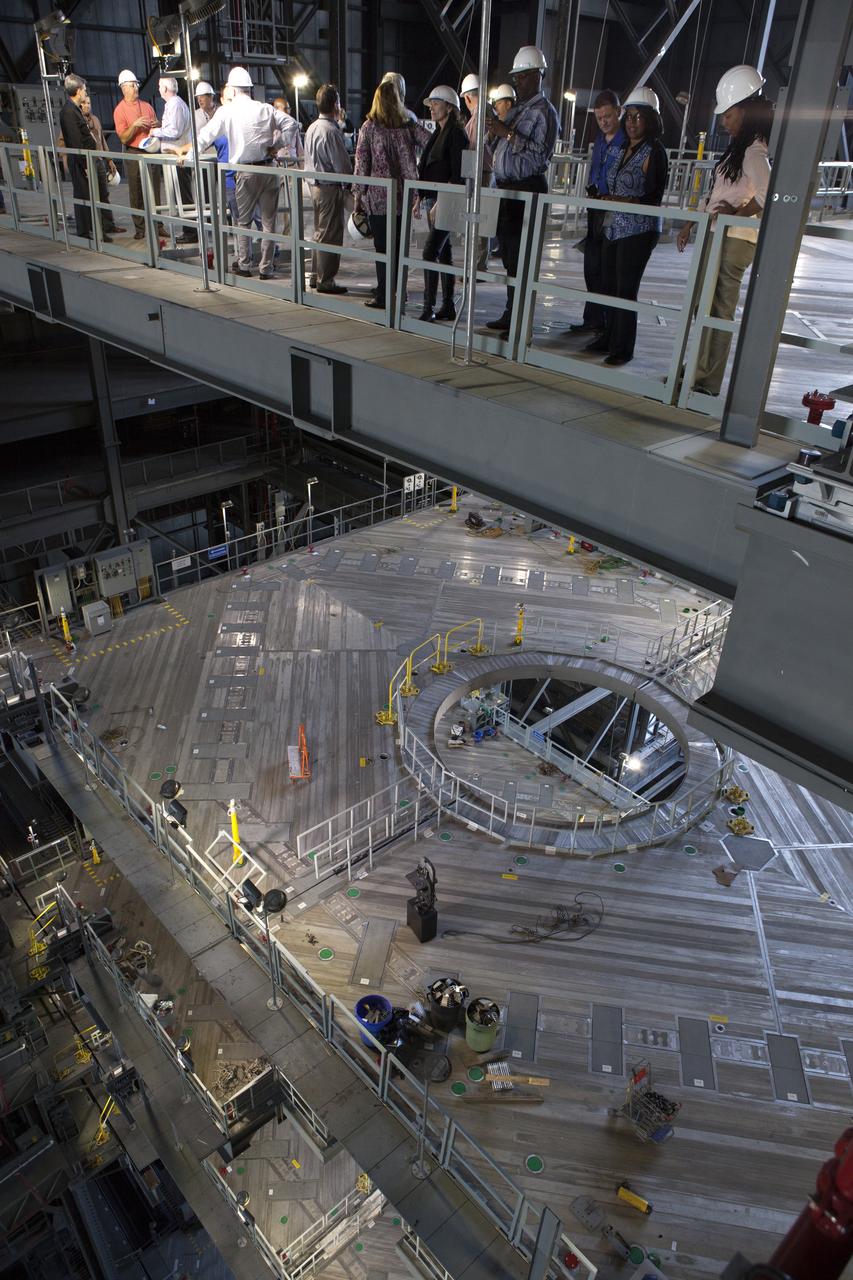 Members of NASA’s Engineering Management Board visit the Vehicle Assembly Building’s High Bay 3 at Kennedy Space Center in Florida. The platforms in High Bay 3, including the one on which the board members are standing, were designed to surround and provide access to NASA’s Space Launch System and Orion spacecraft. The Engineering Management Board toured integral areas of Kennedy to help the agencywide group reach its goal of unifying engineering work across NASA.