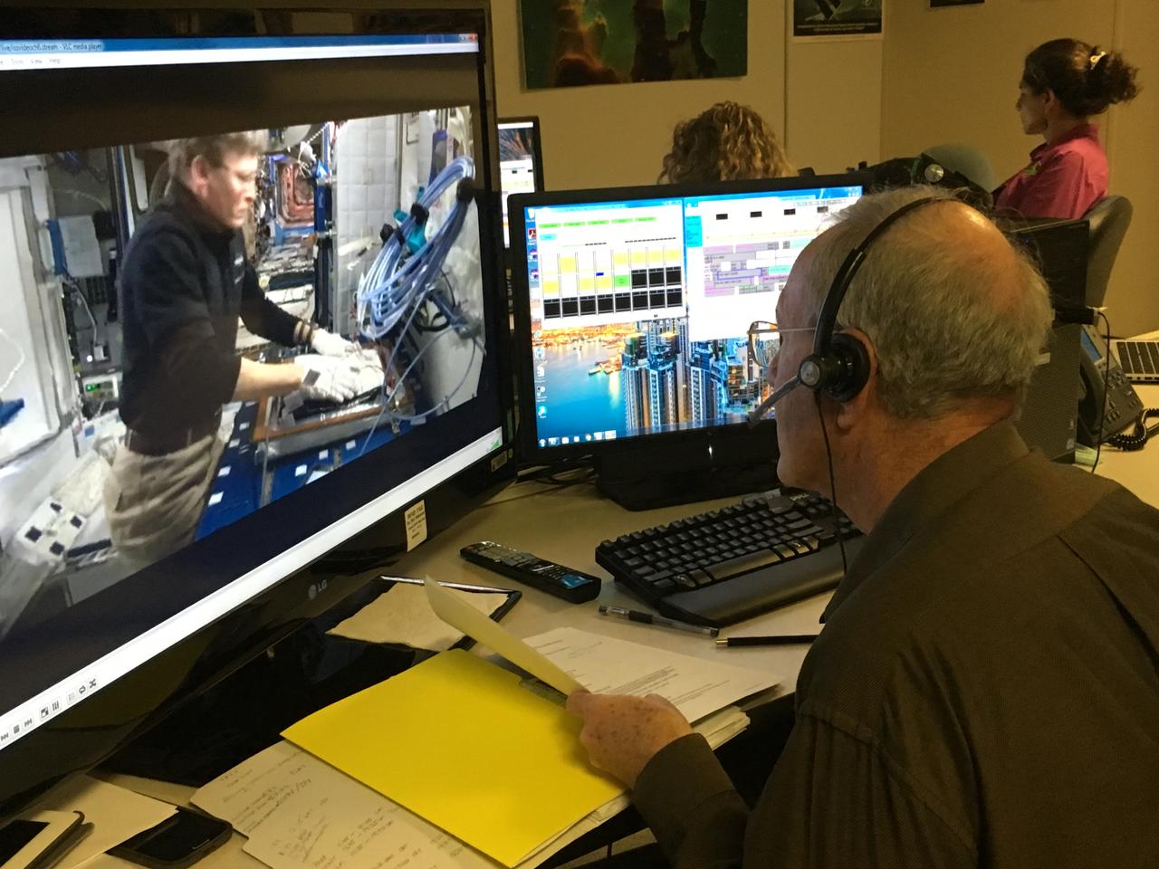 Charles Spern, project manager on the Engineering Services Contract, communicates instructions for the Veggie system to astronaut Peggy Whitson aboard the International Space Station during the initiation of the second Chinese cabbage to be grown aboard the orbiting laboratory on April 3, 2017.