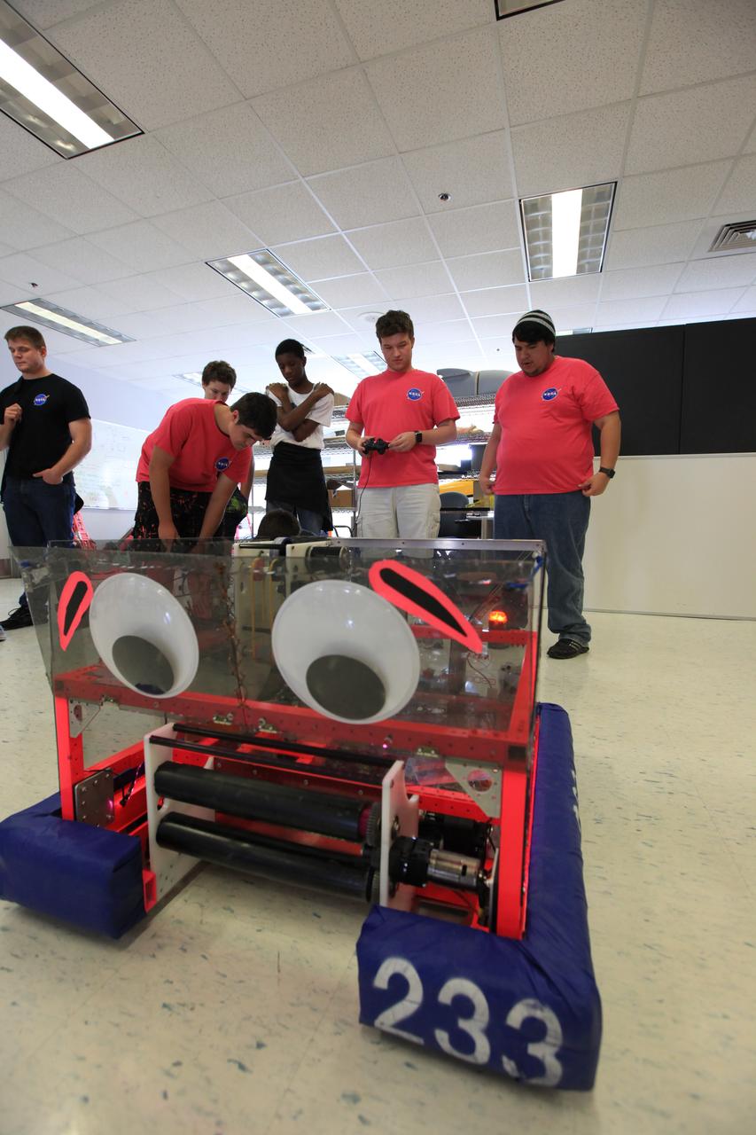 Comprised of students from Cocoa Beach, Rockledge, Viera and Space Coast high schools, the robotics group known as the "Pink Team," its mentors and support personnel celebrated a successful season near the Shuttle Landing Facility at NASA's Kennedy Space Center on April 5. The Pink Team fared well in the two regionals it competed in this year in West Palm Beach, Florida, and the University of Central Florida in Orlando.