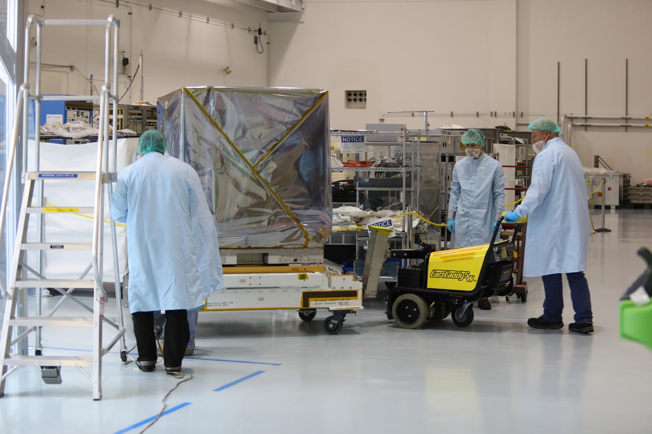 Inside the Space Station Processing Facility high bay at NASA's Kennedy Space Center in Florida, technicians prepare the Neutron star Interior Composition Explorer, or NICER, payload for final packaging. NICER will be delivered to the International Space Station aboard the SpaceX Dragon cargo carrier on the company’s 11th commercial resupply services mission to the space station. NICER will study neutron stars through soft X-ray timing. NICER will enable rotation-resolved spectroscopy of the thermal and non-thermal emissions of neutron stars in the soft X-ray band with unprecedented sensitivity, probing interior structure, the origins of dynamic phenomena and the mechanisms that underlie the most powerful cosmic particle accelerators known.