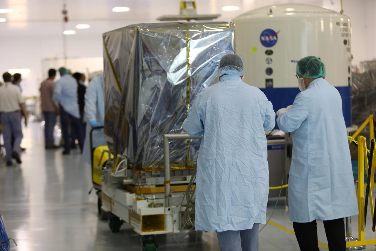 Inside the Space Station Processing Facility high bay at NASA's Kennedy Space Center in Florida, technicians prepare the Neutron star Interior Composition Explorer, or NICER, payload for final packaging. NICER will be delivered to the International Space Station aboard the SpaceX Dragon cargo carrier on the company’s 11th commercial resupply services mission to the space station. NICER will study neutron stars through soft X-ray timing. NICER will enable rotation-resolved spectroscopy of the thermal and non-thermal emissions of neutron stars in the soft X-ray band with unprecedented sensitivity, probing interior structure, the origins of dynamic phenomena and the mechanisms that underlie the most powerful cosmic particle accelerators known. 