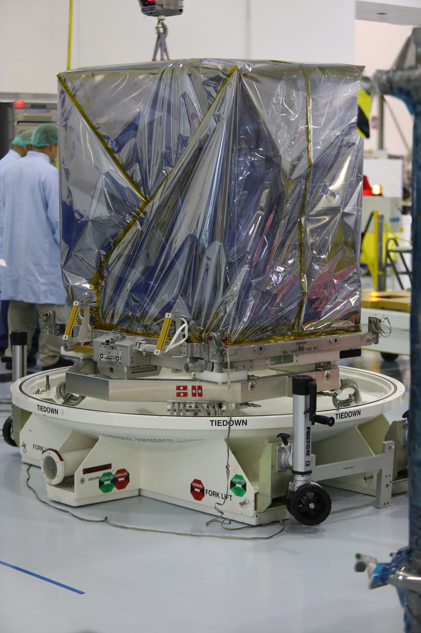 Inside the Space Station Processing Facility high bay at NASA's Kennedy Space Center in Florida, the Neutron star Interior Composition Explorer, or NICER, payload is secured on a special test stand. NICER will be delivered to the International Space Station aboard the SpaceX Dragon cargo carrier on the company’s 11th commercial resupply services mission to the space station. NICER will study neutron stars through soft X-ray timing. NICER will enable rotation-resolved spectroscopy of the thermal and non-thermal emissions of neutron stars in the soft X-ray band with unprecedented sensitivity, probing interior structure, the origins of dynamic phenomena and the mechanisms that underlie the most powerful cosmic particle accelerators known. 