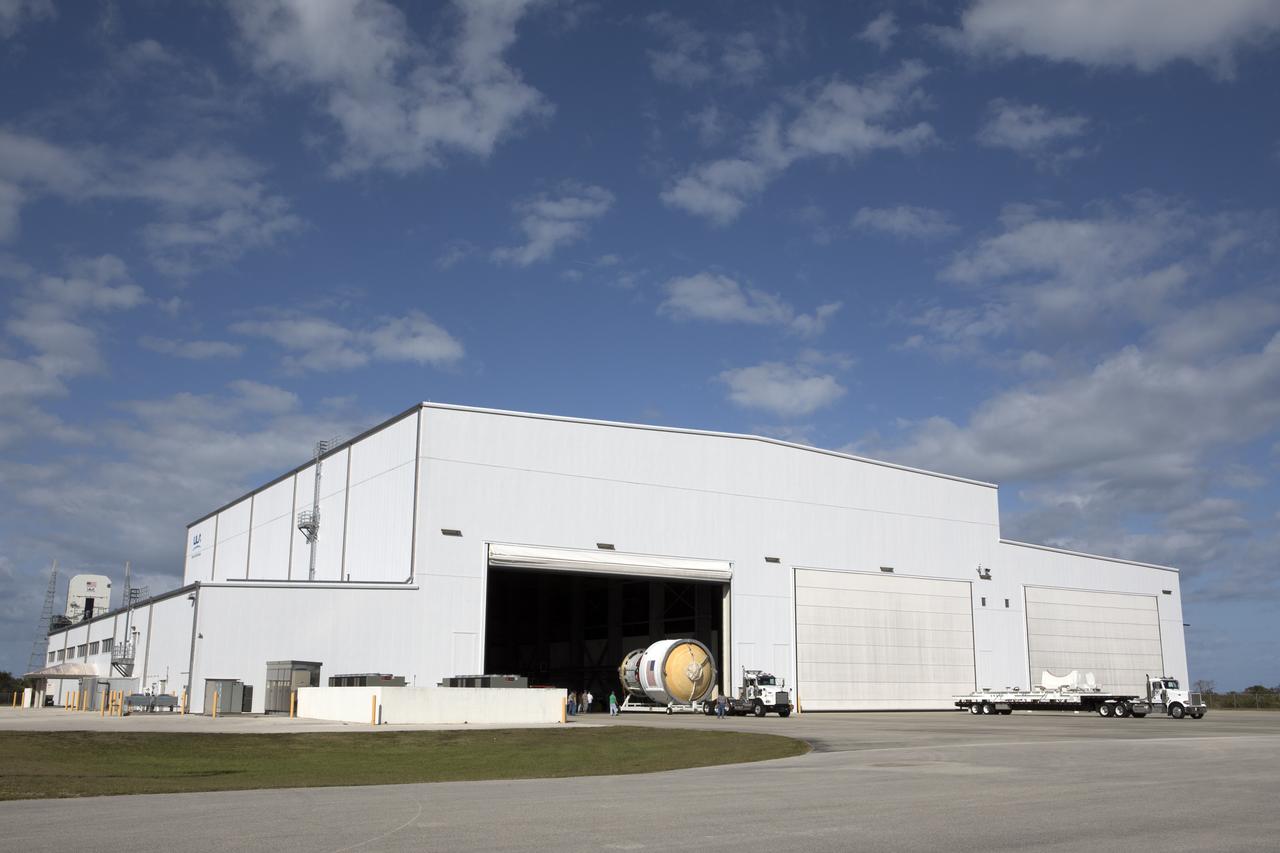 The Interim Cryogenic Propulsion Stage (ICPS) for NASA's Space Launch System (SLS) rocket is moved on its transport stand by truck out of the United Launch Alliance (ULA) Horizontal Integration Facility near Space Launch Complex 37 at Cape Canaveral Air Force Station in Florida. The ICPS will be transported to the Delta Operations Center. The ICPS is the first integrated piece of flight hardware to arrive for the SLS. It is the in-space stage that is located toward the top of the rocket, between the Launch Vehicle Stage Adapter and the Orion Spacecraft Adapter. It will provide some of the in-space propulsion during Orion's first flight test atop the SLS on Exploration Mission-1.