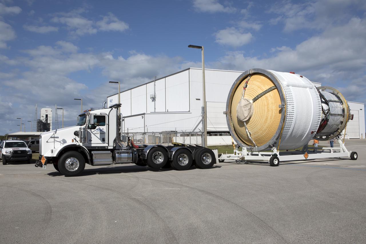The Interim Cryogenic Propulsion Stage (ICPS) for NASA's Space Launch System (SLS) rocket has been moved on its transport stand by truck out of the United Launch Alliance (ULA) Horizontal Integration Facility near Space Launch Complex 37 at Cape Canaveral Air Force Station in Florida, on its way to the Delta Operations Center. The ICPS is the first integrated piece of flight hardware to arrive for the SLS. It is the in-space stage that is located toward the top of the rocket, between the Launch Vehicle Stage Adapter and the Orion Spacecraft Adapter. It will provide some of the in-space propulsion during Orion's first flight test atop the SLS on Exploration Mission-1. 