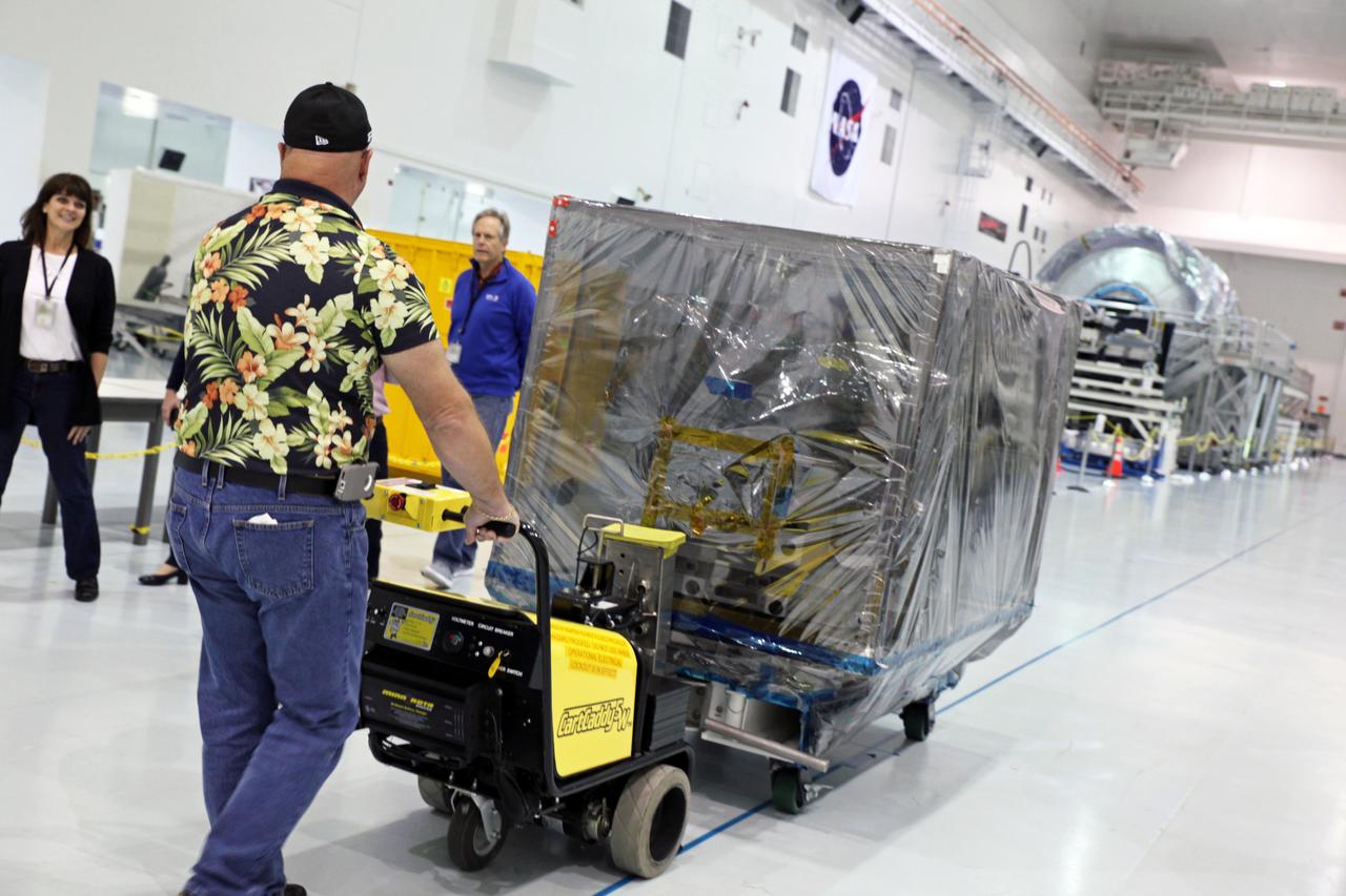 Inside the Space Station Processing Facility high bay at NASA's Kennedy Space Center in Florida, the Roll-Out Solar Array, or ROSA, is being prepared for transfer out of the high bay. ROSA will be delivered to the International Space Station aboard the SpaceX Dragon cargo carrier on the company’s 11th commercial resupply services mission to the space station. ROSA is a new type of solar panel that rolls open in space and is more compact than current rigid panel designs. The ROSA investigation will test deployment and retraction, shape changes when the Earth blocks the sun, and other physical challenges to determine the array's strength and durability.