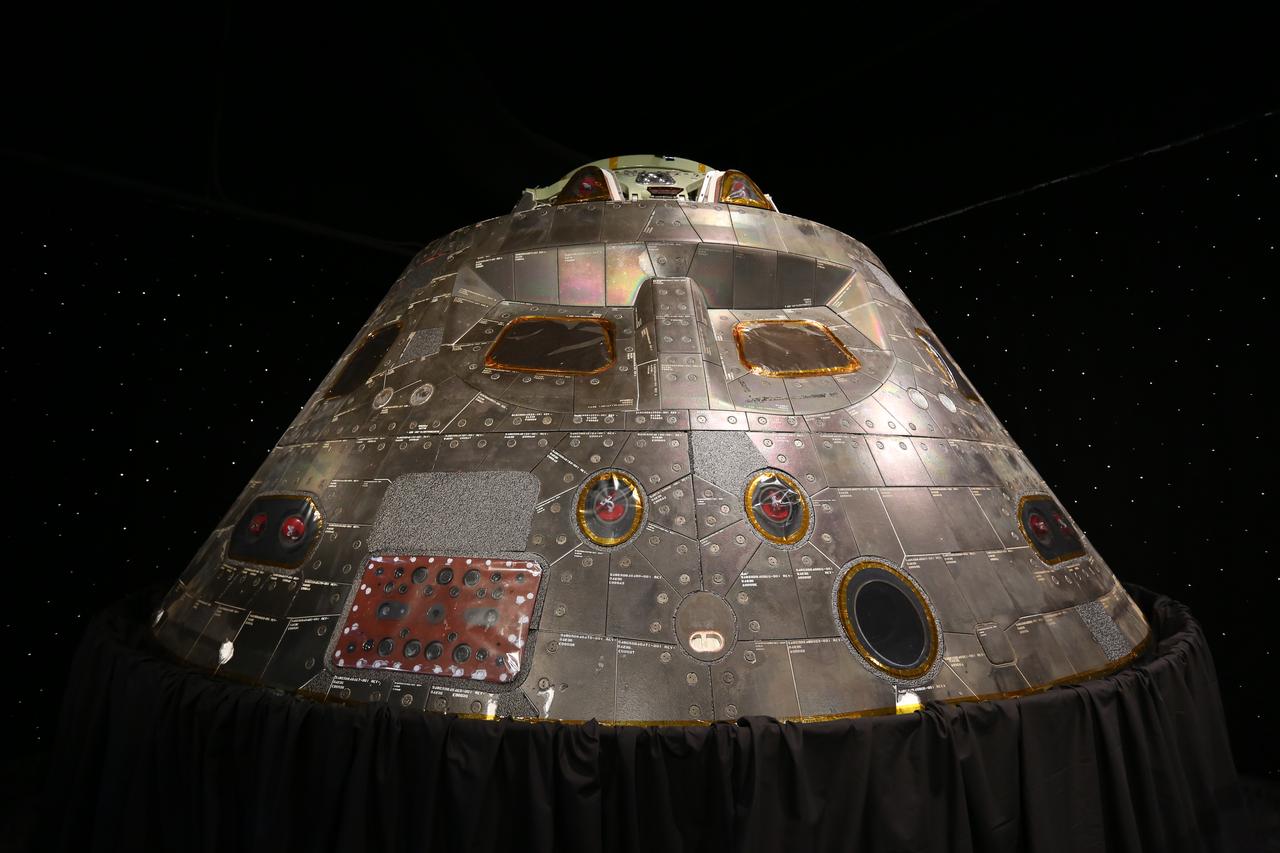 A close-up view of the Orion crew module from Exploration Flight Test 1 (EFT-1) on display at nearby NASA Kennedy Space Center Visitor Complex in Florida. The crew module is part of the NASA Now exhibit in the IMAX Theater. The Orion EFT-1 spacecraft launched atop a United Launch Alliance Delta IV rocket Dec. 5, 2014, from Space Launch Complex 37 at Cape Canaveral Air Force Station. The spacecraft built for humans traveled 3,604 miles above Earth and splashed down about 4.5 hours later in the Pacific Ocean. 