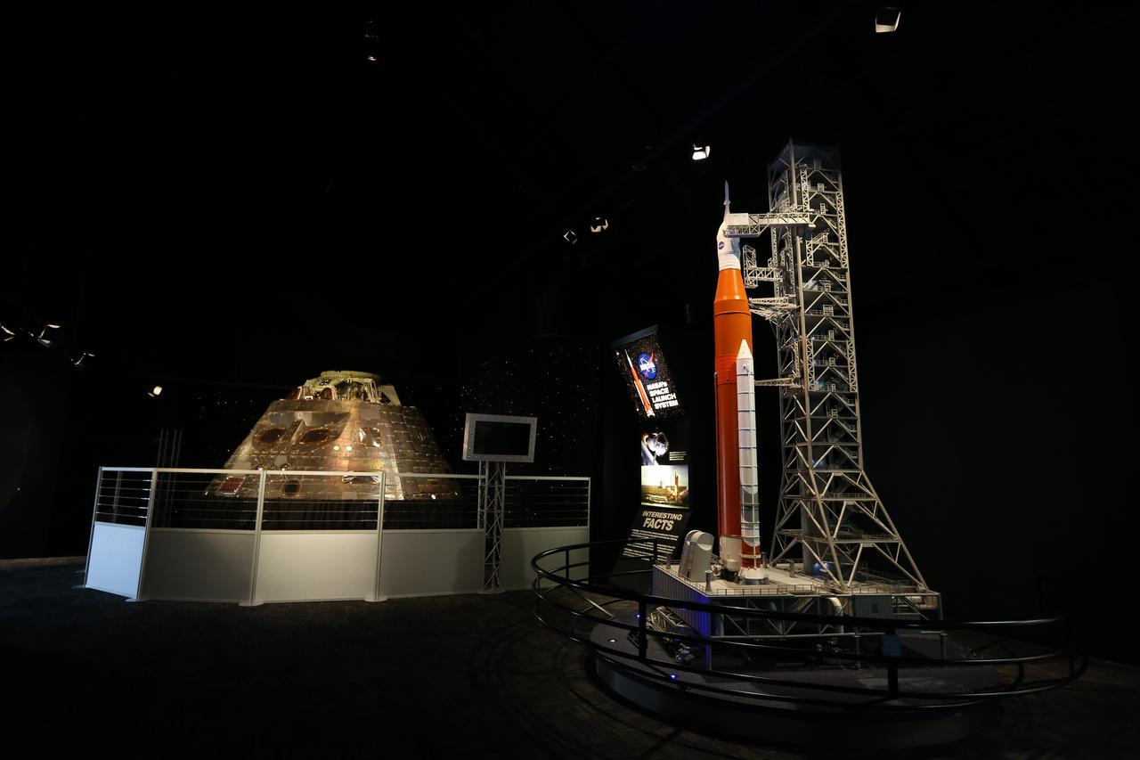 The Orion crew module from Exploration Flight Test 1 (EFT-1) is on display at nearby NASA Kennedy Space Center Visitor Complex in Florida. The crew module is part of the NASA Now exhibit in the IMAX Theater. Also in view is a scale model of NASA's Space Launch System rocket and Orion spacecraft on the mobile launcher. The Orion EFT-1 spacecraft launched atop a United Launch Alliance Delta IV rocket Dec. 5, 2014, from Space Launch Complex 37 at Cape Canaveral Air Force Station. The spacecraft built for humans traveled 3,604 miles above Earth and splashed down about 4.5 hours later in the Pacific Ocean. 
