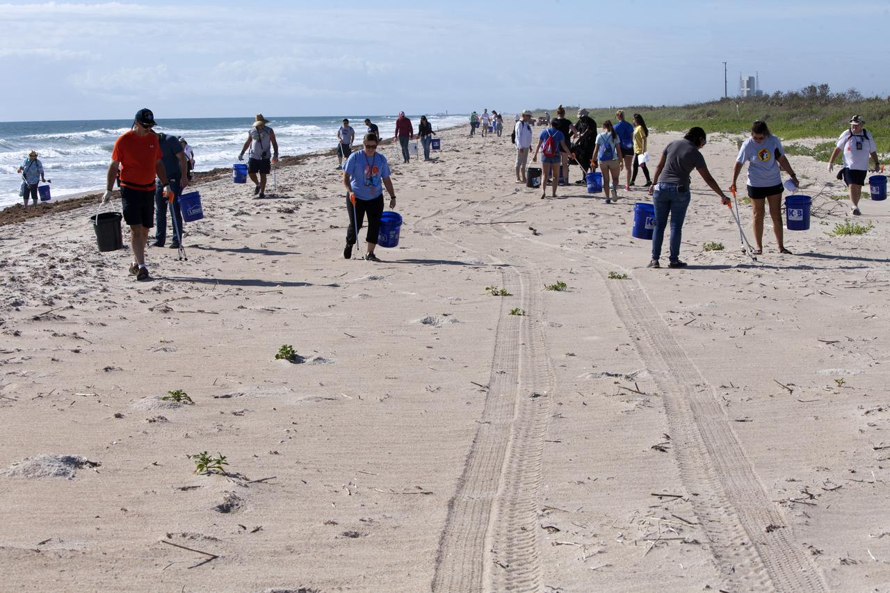 About 50 participants led by NASA Kennedy Space Center's Employee Resource Groups picked up about 20 bags of trash and other large debris along the center's shoreline before turtle-nesting season as a community service. Sea turtle-nesting season begins in about one month. Unlike what might be found along a public beach, all of the debris that litters Kennedy’s restricted beaches washes ashore after being discarded at sea. Of the 72 miles of beach that form the eastern boundary of Brevard County, Florida, about six of those miles line Kennedy.  