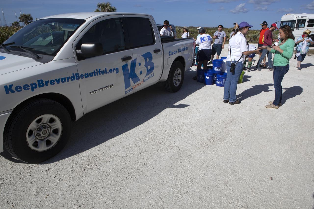About 50 participants led by NASA Kennedy Space Center's Employee Resource Groups picked up about 20 bags of trash and other large debris along the center's shoreline before turtle-nesting season as a community service. Sea turtle-nesting season begins in about one month. Unlike what might be found along a public beach, all of the debris that litters Kennedy’s restricted beaches washes ashore after being discarded at sea. Of the 72 miles of beach that form the eastern boundary of Brevard County, Florida, about six of those miles line Kennedy.  