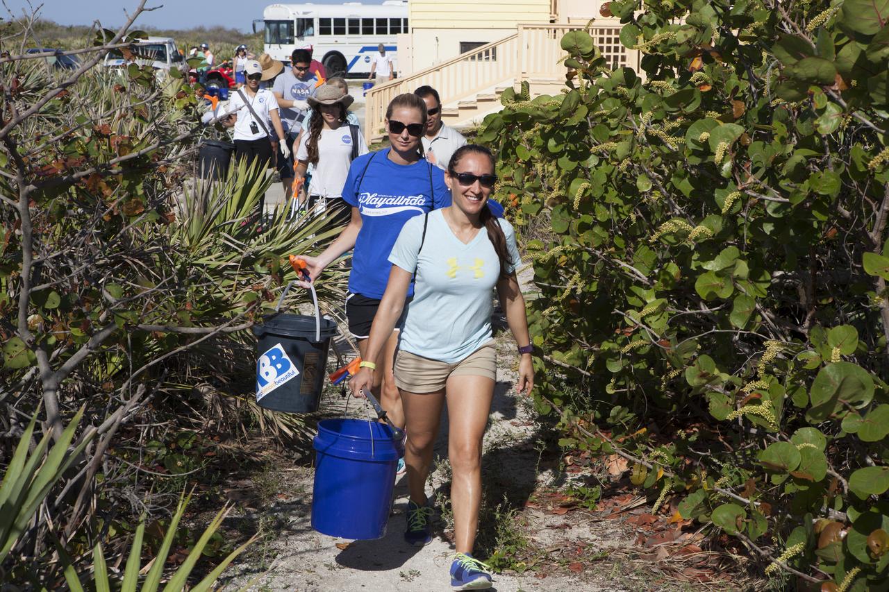 About 50 participants led by NASA Kennedy Space Center's Employee Resource Groups picked up about 20 bags of trash and other large debris along the center's shoreline before turtle-nesting season as a community service. Sea turtle-nesting season begins in about one month. Unlike what might be found along a public beach, all of the debris that litters Kennedy’s restricted beaches washes ashore after being discarded at sea. Of the 72 miles of beach that form the eastern boundary of Brevard County, Florida, about six of those miles line Kennedy.  