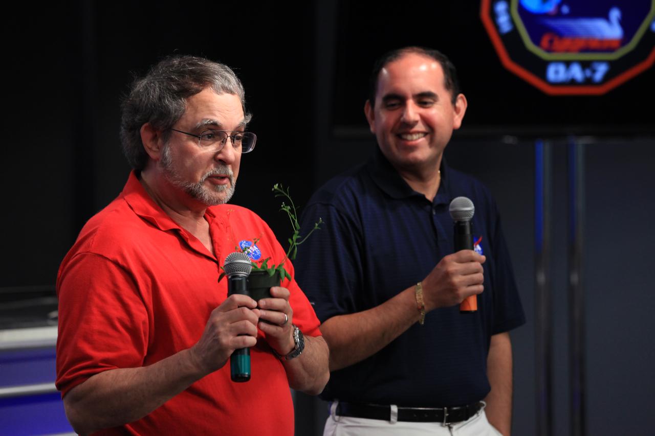 From left, Dr. Howard Levine, project specialist, and Bryan Onate, program manager, at NASA's Kennedy Space Center in Florida, discusses the  Advanced Plant Habitat during a "What's on Board" science briefing to NASA Social participants at Kennedy. The briefing is for Orbital ATK's seventh commercial resupply services mission, CRS-7, to the International Space Station. Orbital ATK's Cygnus pressurized cargo module is set to launch on the United Launch Alliance Atlas V rocket from Space Launch Complex 41 at Cape Canaveral Air Force Station on April 18. Liftoff is scheduled for 11:11 a.m. EDT. 