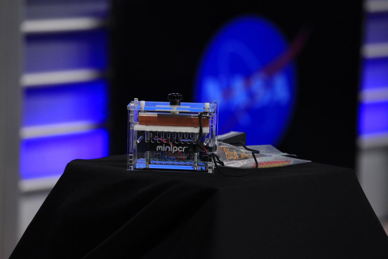 An example of the Genes in Space II winning student experiment is on display during a "What's on Board" science briefing to NASA Social participants at the agency's Kennedy Space Center in Florida. The briefing was for Orbital ATK's seventh commercial resupply services mission, CRS-7, to the International Space station. Orbital ATK's Cygnus pressurized cargo module is set to launch on the United Launch Alliance Atlas V rocket from Space Launch Complex 41 at Cape Canaveral Air Force Station on April 18. Liftoff is scheduled for 11:11 a.m. EDT. 