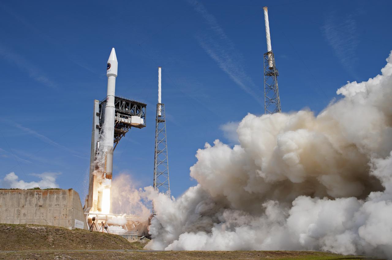 With blue sky for a background, the Orbital ATK Cygnus pressurized cargo module is carried atop the United Launch Alliance Atlas V rocket from Space Launch Complex 41 at Cape Canaveral Air Force Station in Florida. Orbital ATK's seventh commercial resupply services mission, CRS-7, will deliver 7,600 pounds of supplies, equipment and scientific research materials to the International Space Station. Liftoff was at 11:11 a.m. EDT. 