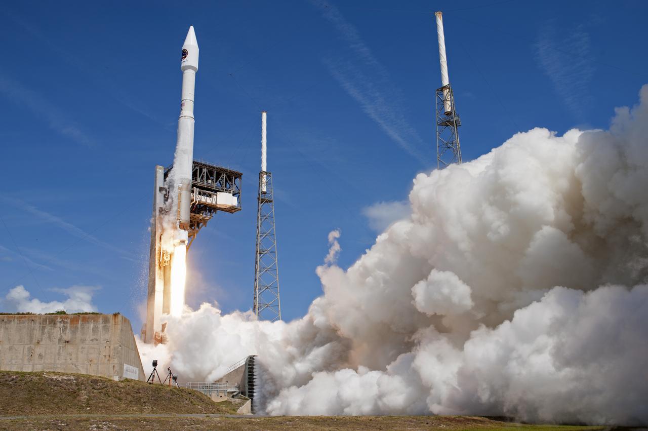With blue sky for a background, the Orbital ATK Cygnus pressurized cargo module is carried atop the United Launch Alliance Atlas V rocket from Space Launch Complex 41 at Cape Canaveral Air Force Station in Florida. Orbital ATK's seventh commercial resupply services mission, CRS-7, will deliver 7,600 pounds of supplies, equipment and scientific research materials to the International Space Station. Liftoff was at 11:11 a.m. EDT. 