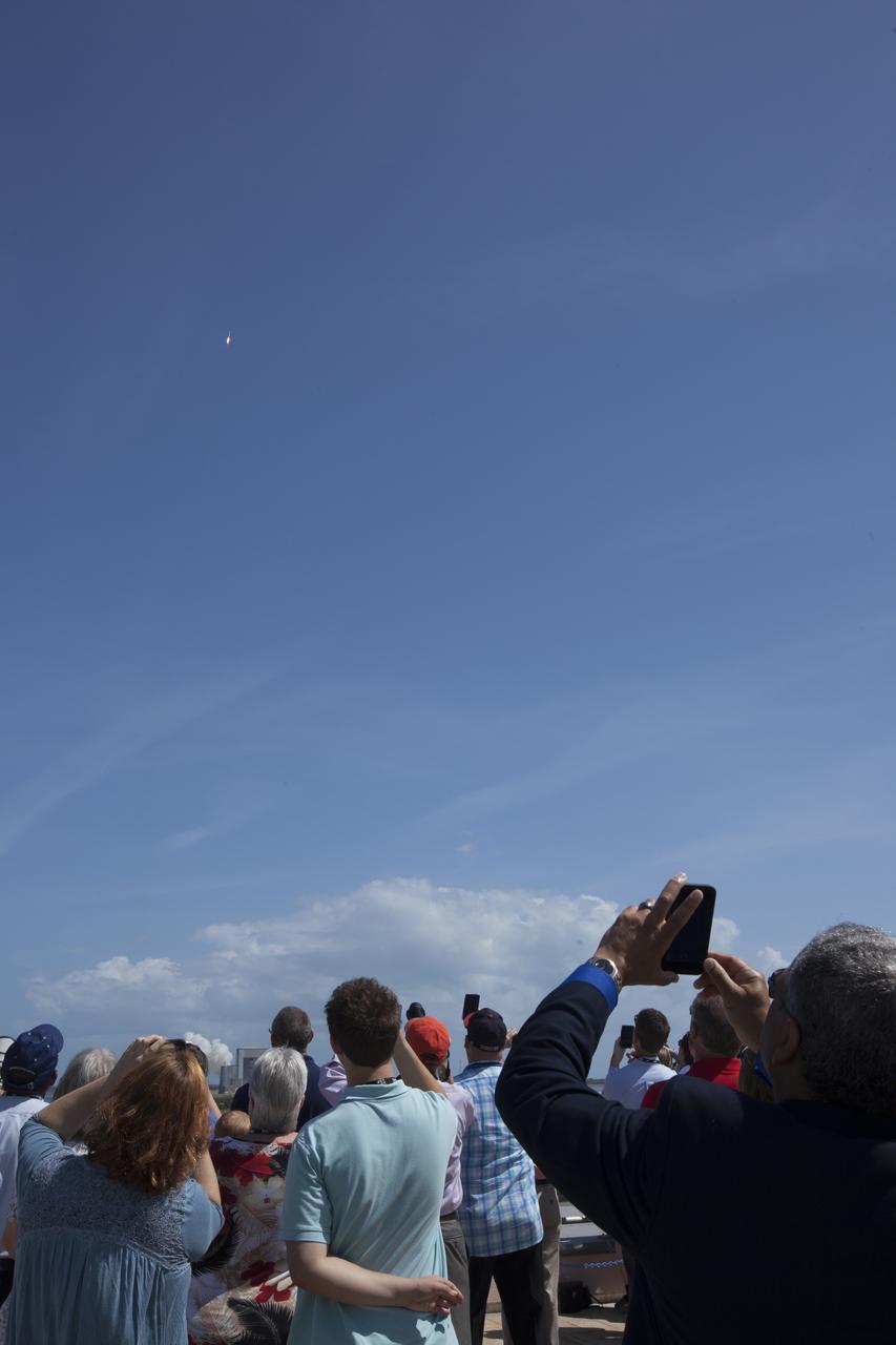Social media guests watch a United Launch Alliance Atlas V rocket soar upward after lliftoff at 11:11 a.m. EDT from Space Launch Complex 41 at Cape Canaveral Air Force Station in Florida, carrying the Orbital ATK Cygnus pressurized cargo module on the company's seventh commercial resupply services mission to the International Space Station. Cygnus will deliver 7,600 pounds of supplies, equipment and scientific research materials to the space station.