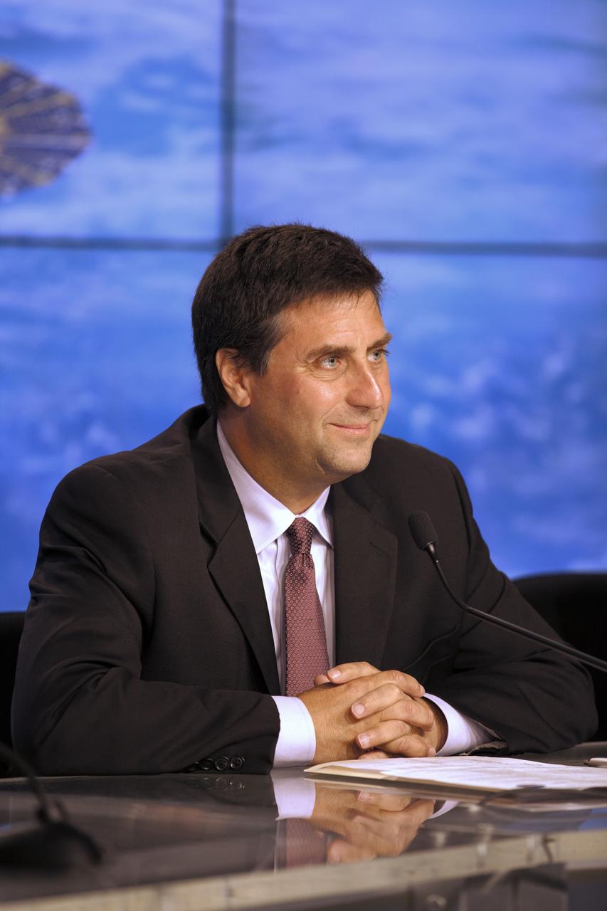 Members of the news media attend a press conference at NASA's Kennedy Space Center in Florida, after the launch of the Orbital ATK Cygnus pressurized cargo module atop a United Launch Alliance Atlas V rocket from Space Launch Complex 41 at Cape Canaveral Air Force Station. It was Orbital ATK's seventh commercial resupply services mission to the International Space Station. Liftoff was at 11:11 a.m. EDT. Speaking to the media is Joel Montalbano, deputy manager, International Space Station Program, NASA Johnson Space Center in Houston.