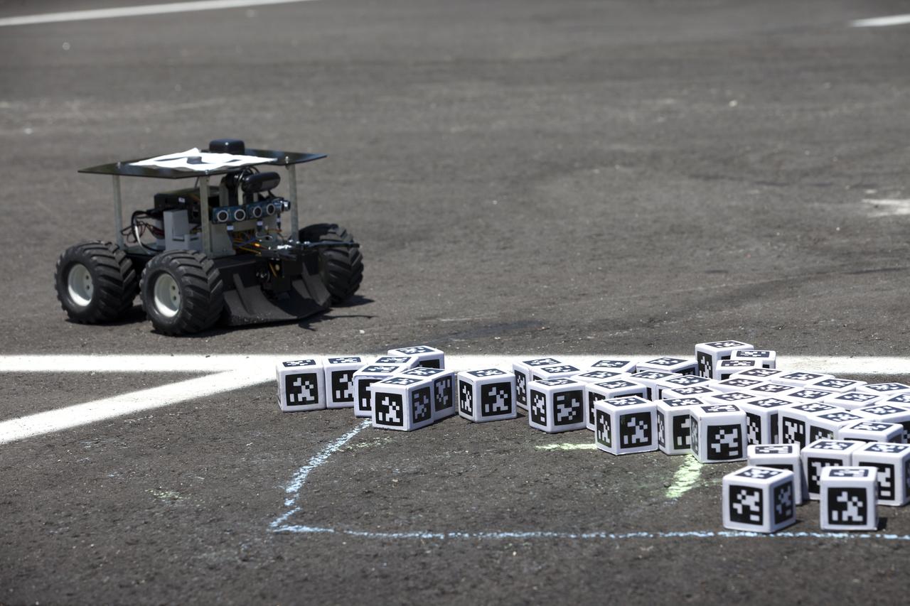 In the Swarmathon competition at the Kennedy Space Center Visitor Complex, students were asked to develop computer code for the small robots, programming them to look for "resources" in the form of AprilTag cubes, similar to barcodes. Teams developed search algorithms for the Swarmies to operate autonomously, communicating and interacting as a collective swarm similar to ants foraging for food. In the spaceport's second annual Swarmathon, 20 teams representing 22 minority serving universities and community colleges were invited to develop software code to operate these innovative robots known as "Swarmies" to help find resources when astronauts explore distant locations, such as the moon or Mars.