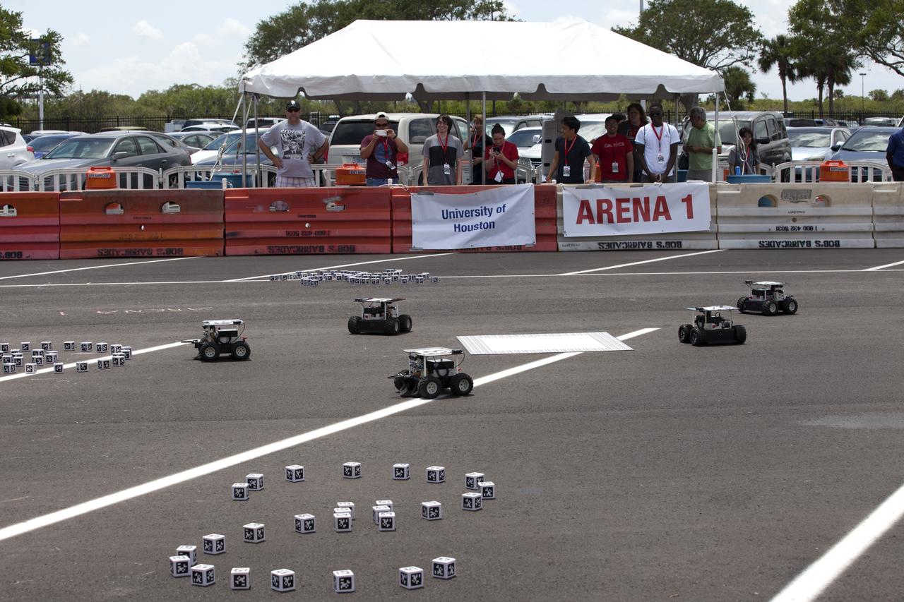 In the Swarmathon competition at the Kennedy Space Center Visitor Complex, students were asked to develop computer code for the small robots, programming them to look for "resources" in the form of cubes with AprilTags, similar to barcodes. Teams developed search algorithms for innovative robots known as "Swarmies" to operate autonomously, communicating and interacting as a collective swarm similar to ants foraging for food. In the spaceport's second annual Swarmathon, 20 teams representing 22 minority serving universities and community colleges were invited to participate. Similar robots could help find resources when astronauts explore distant locations, such as the moon or Mars.