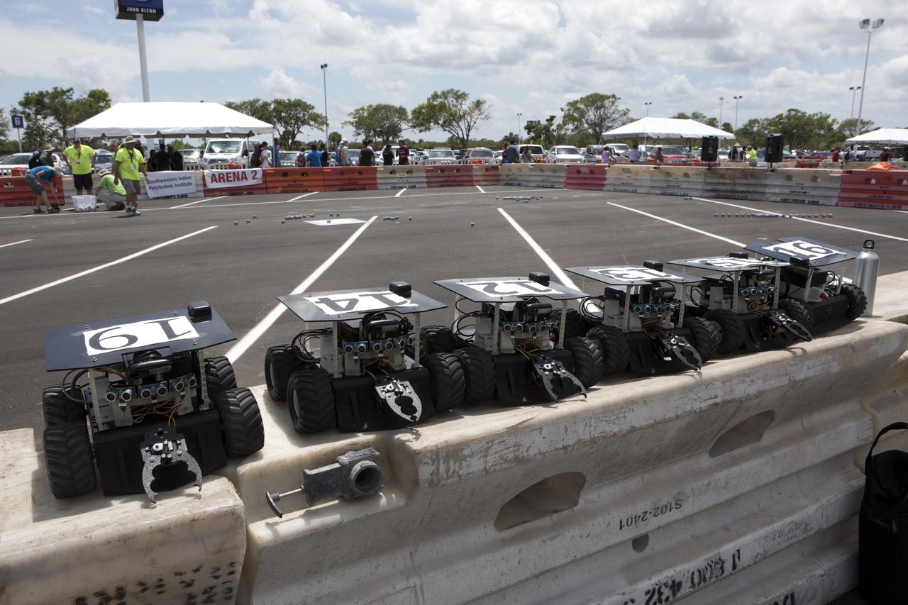 In the Swarmathon competition at the Kennedy Space Center Visitor Complex, students were asked to develop computer code for the small robots, programming them to look for "resources" in the form of cubes with AprilTags, similar to barcodes. Teams developed search algorithms for the Swarmies to operate autonomously, communicating and interacting as a collective swarm similar to ants foraging for food.