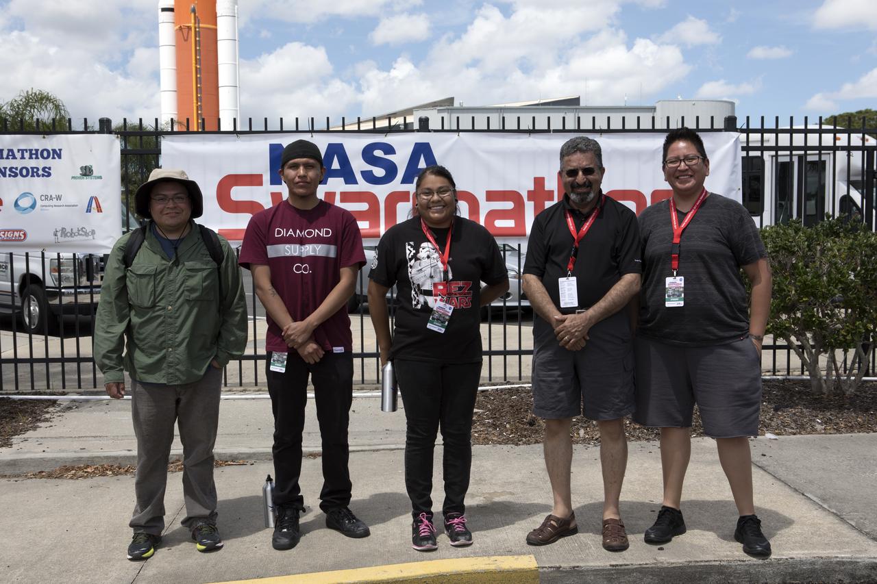 In the second annual Swarmathon competition at NASA's Kennedy Space Center in Florida, students were asked to develop computer code for the small robots called "Swarmies." The students programmed the robots to look for "resources" in the form of cubes with AprilTags, similar to barcodes. A team from Southwestern Indian Polytechnic Institute (SIPI) in Albuquerque, New Mexico, captured first place and a $5,000 cash prize. SIPI team members, from the left, are: students Emery Sutherland, Ty Shurley, Christian Martinez, SIPI engineering professor Dr. Nader Vadiee who was the team's faculty advisor, and student Schulte Cooke.