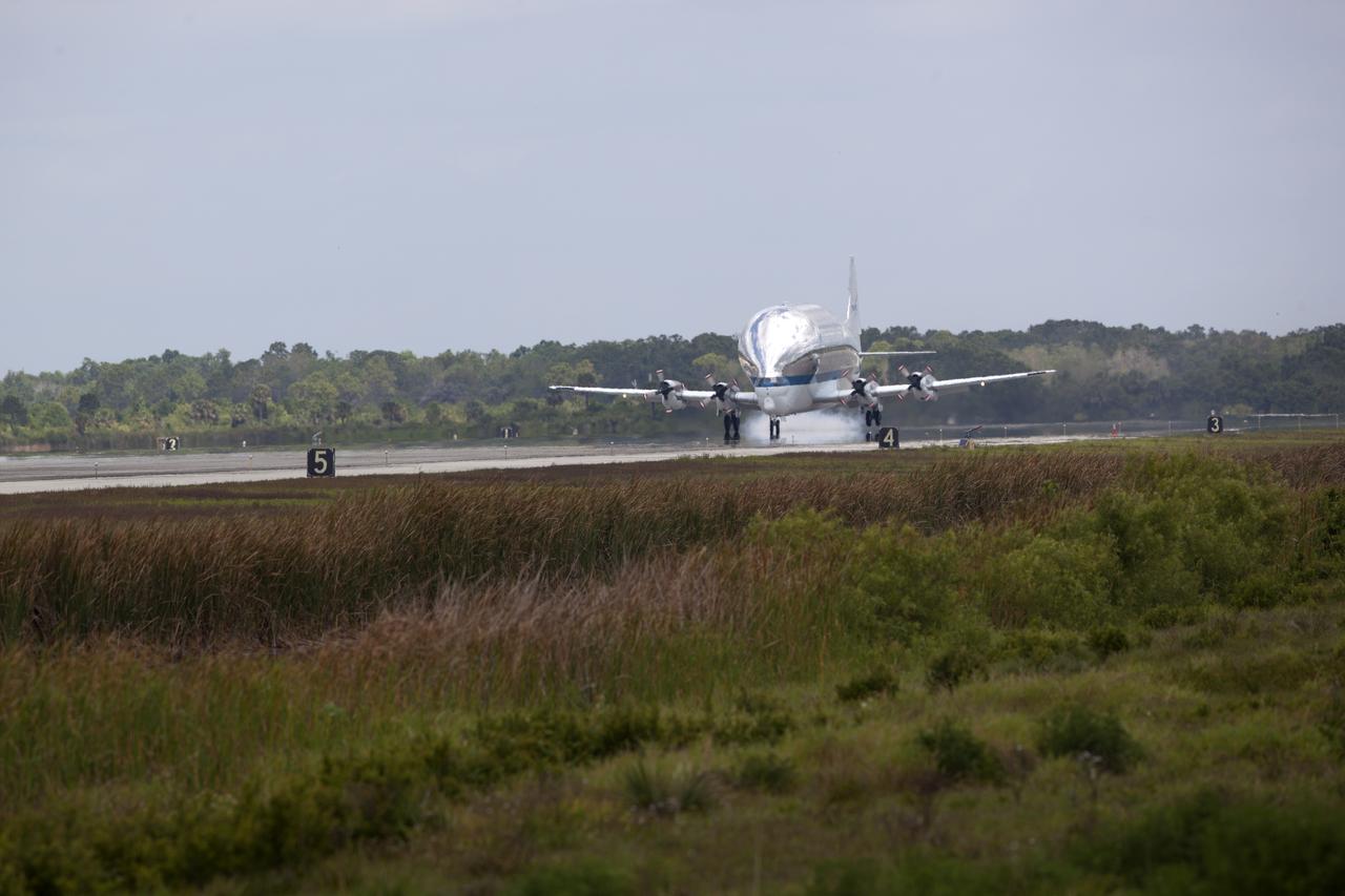 NASA's Super Guppy airplane touches down on the runway at the Shuttle Landing Facility at the agency's Kennedy Space Center in Florida. The Orion Exploration Mission-1 (EM-1) structural test article will be loaded in the Super Guppy and transported to Lockheed Martin's Denver facility for testing. The Orion spacecraft will launch atop NASA’s Space Launch System rocket on EM-1, its first deep space mission. 