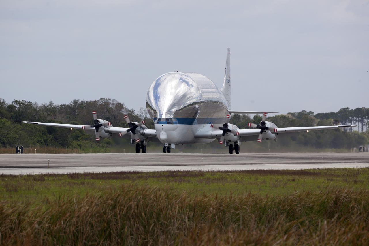 NASA's Super Guppy airplane touches down on the runway at the Shuttle Landing Facility at the agency's Kennedy Space Center in Florida. The Orion Exploration Mission-1 (EM-1) structural test article will be loaded in the Super Guppy and transported to Lockheed Martin's Denver facility for testing. The Orion spacecraft will launch atop NASA’s Space Launch System rocket on EM-1, its first deep space mission. 