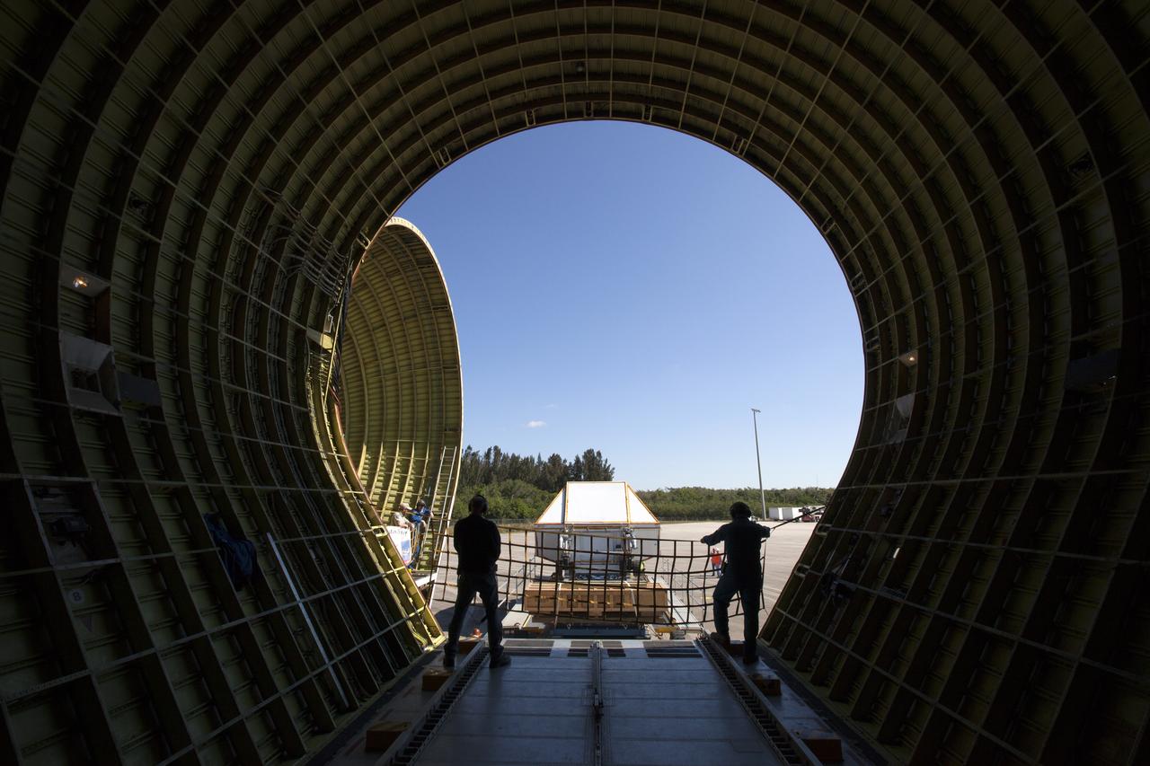 A view from inside NASA's Super Guppy aircraft at the Shuttle Landing Facility at NASA's Kennedy Space Center in Florida. The Orion Exploration Mission-1 (EM-1) structural test article, secured inside its transport container, will be loaded into the Super Guppy for transport to Lockheed Martin's Denver facility for testing. The Orion spacecraft will launch atop NASA’s Space Launch System rocket on EM-1, its first deep space mission.